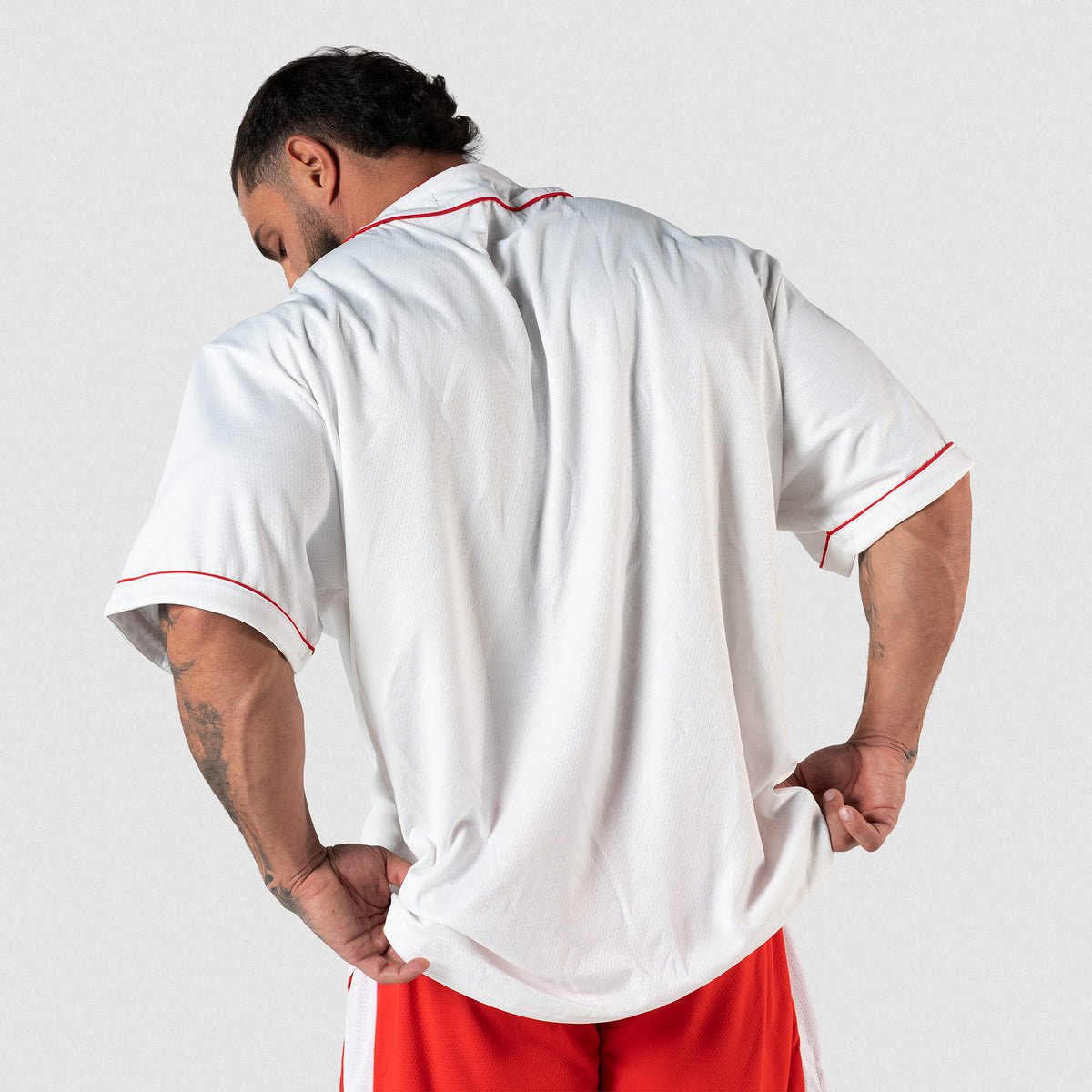Olympia Americana Jersey | Male model facing away to show blank back of jersey