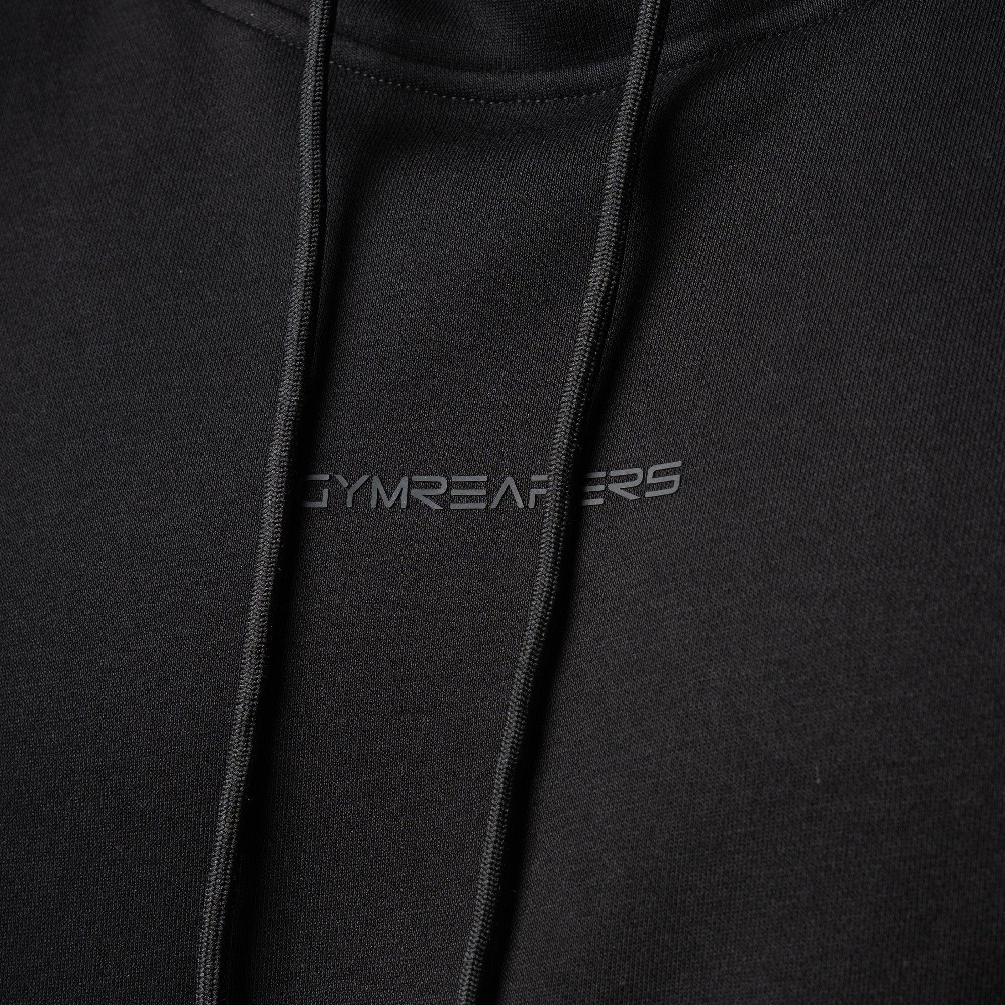 athlete wearing axis mockneck hoodie close up detail shot of logo