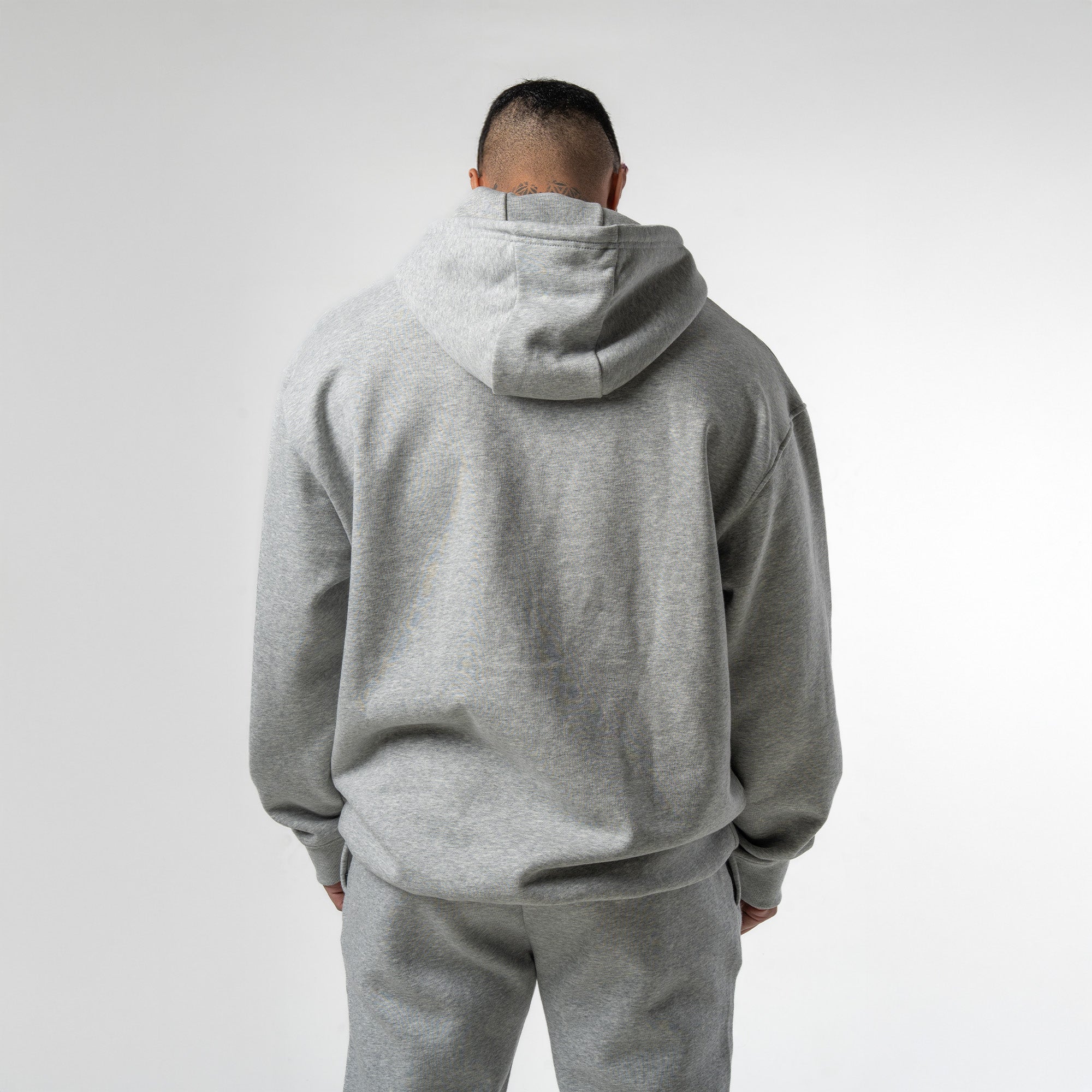 athlete wearing gray axis hoodie back view