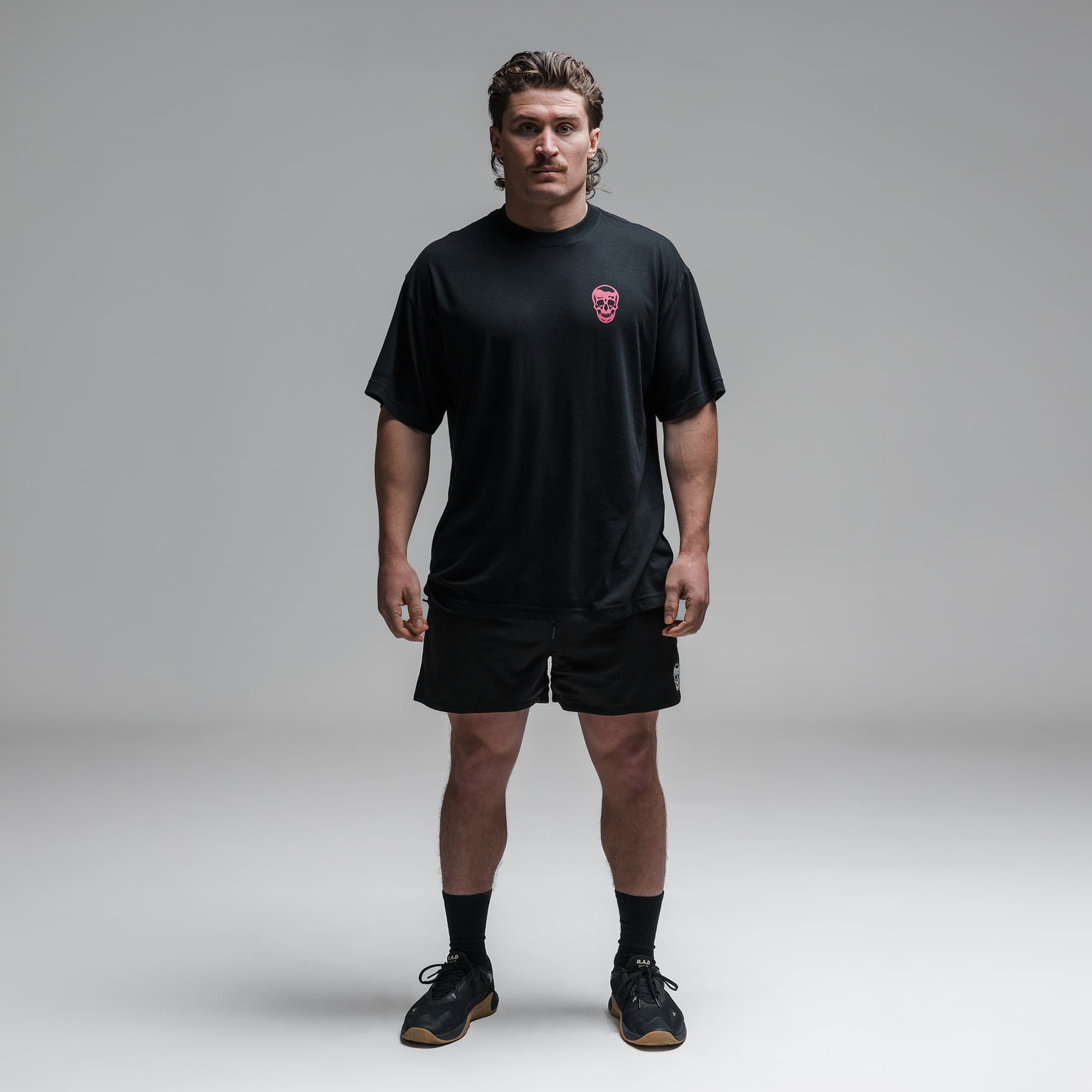 Athlete wearing the Miami Training Club Tee full body shot front view