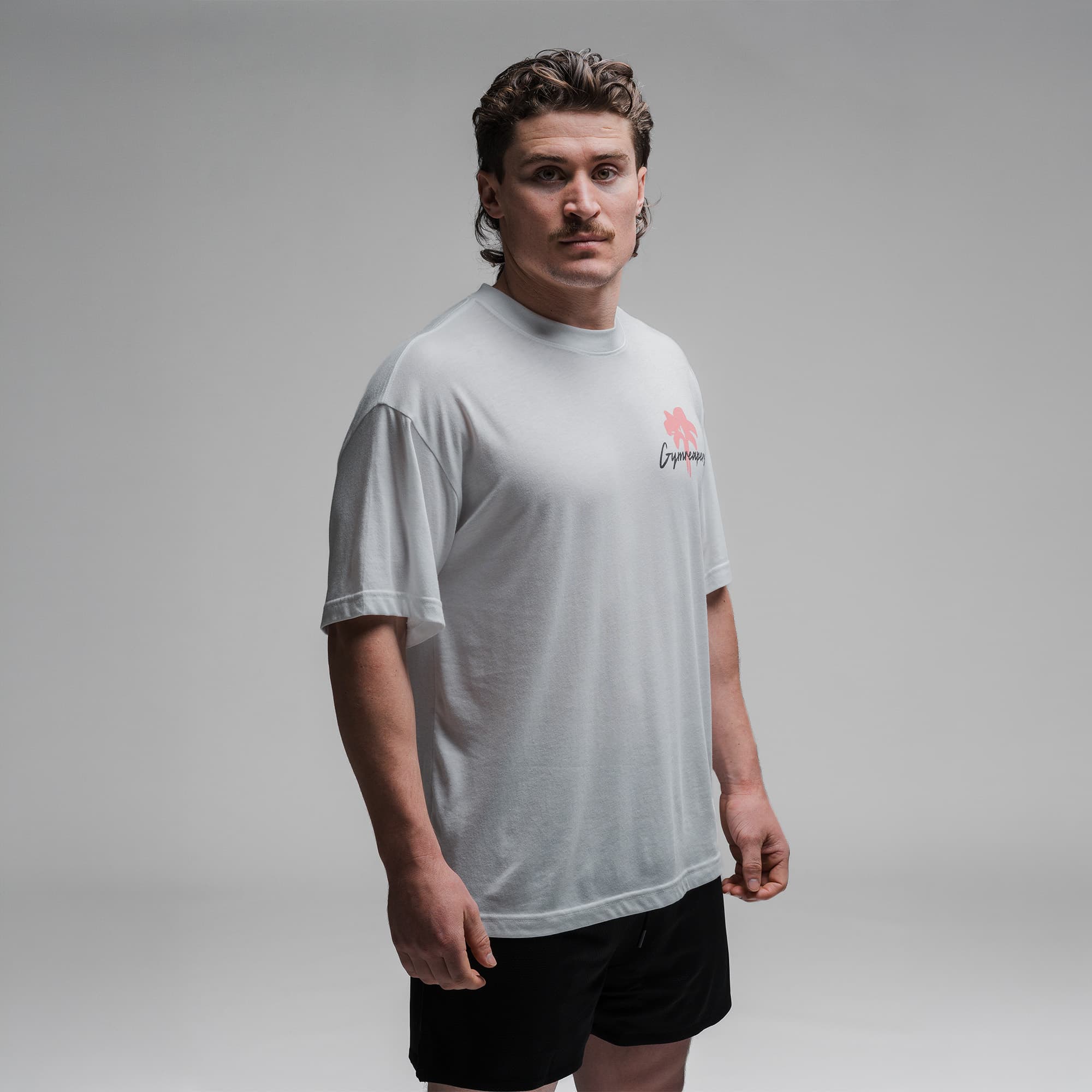 Athlete wearing the Greetings Tee half body shot front side