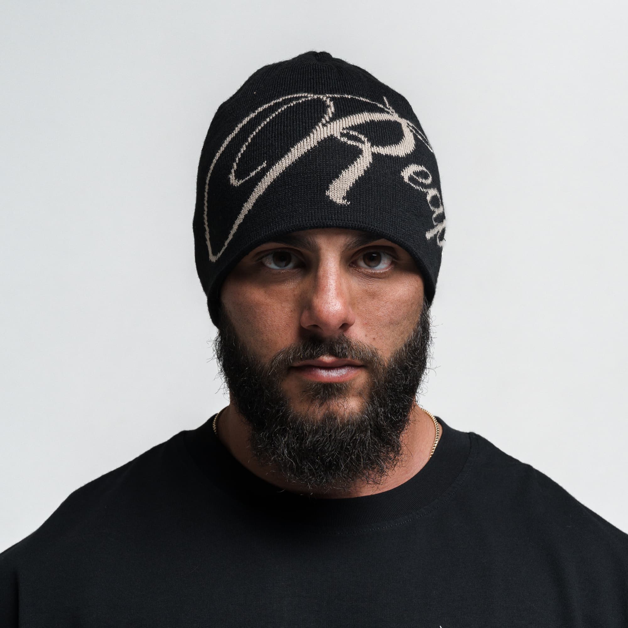 Athlete wearing Reapers Skull Cap Beanie - Black/Tan front view