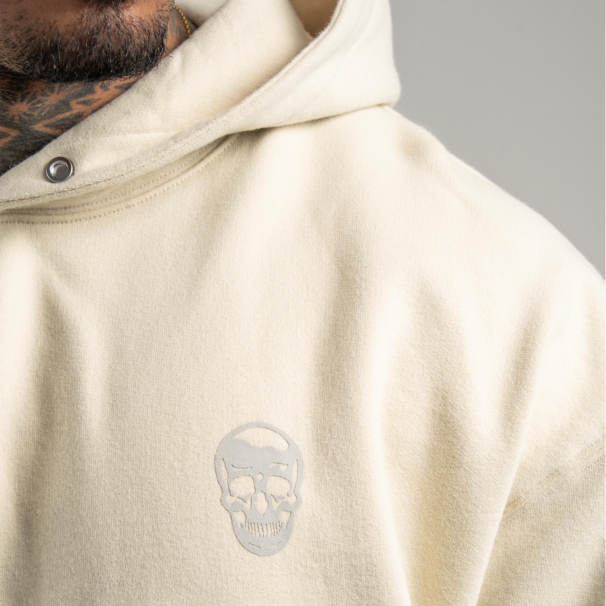 Athlete wearing Bone Heavyweight Hoodie close up shot of logo
