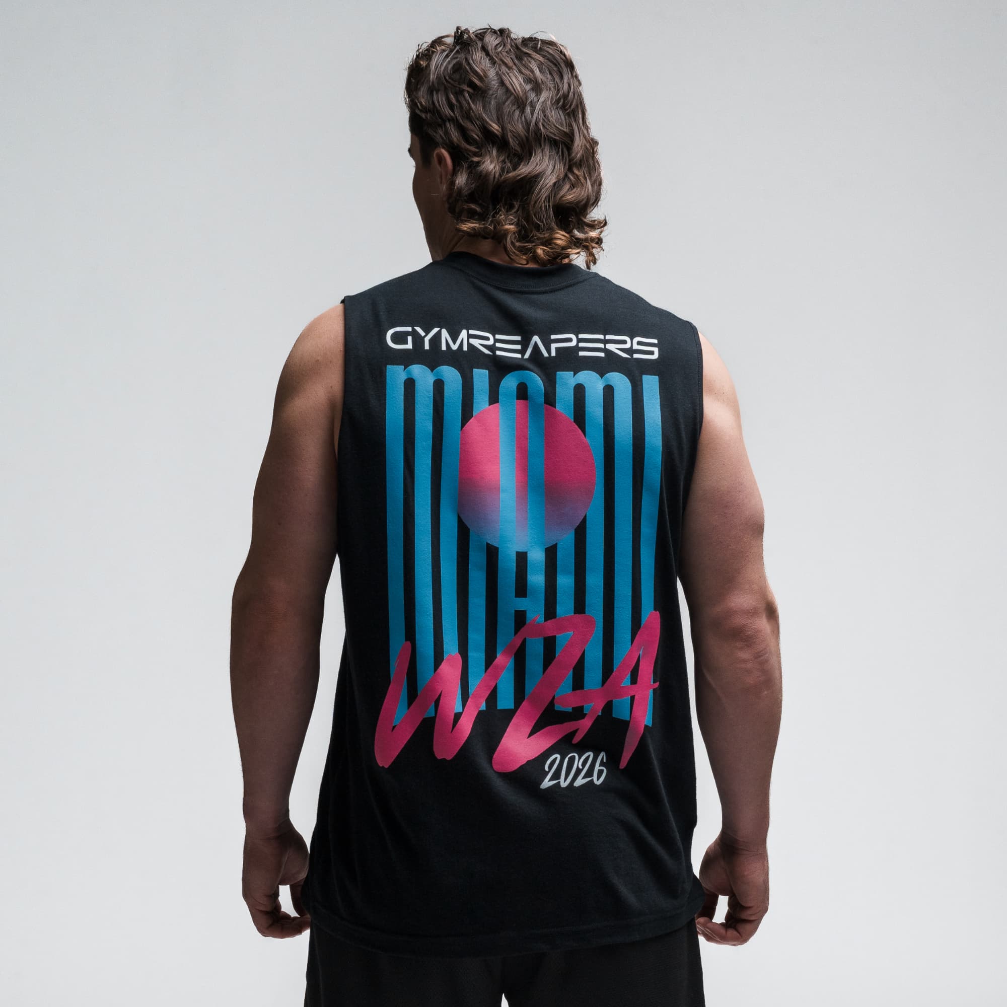 Athlete wearing the Neon Horizon Cut Off half body shot back side