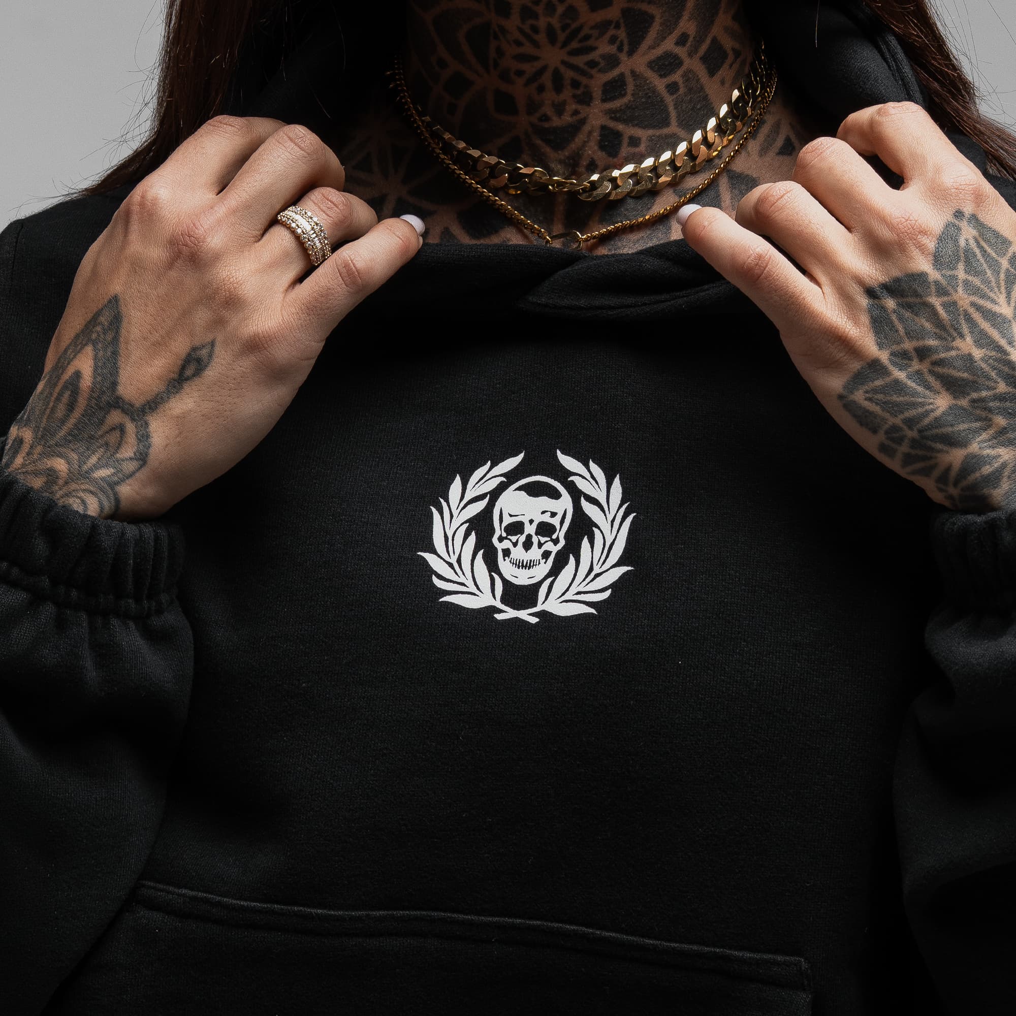 Athlete wearing Loyalty Club Cropped Hoodie close up shot of logo