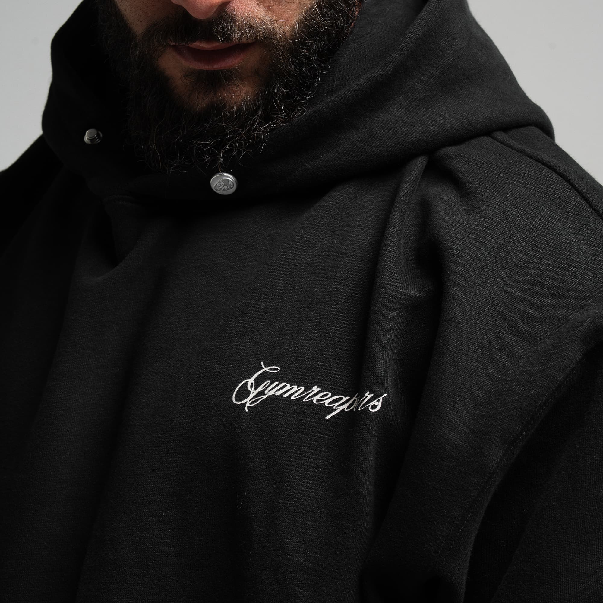 Athlete wearing Midnight Reaper Hoodie close up shot of front graphic