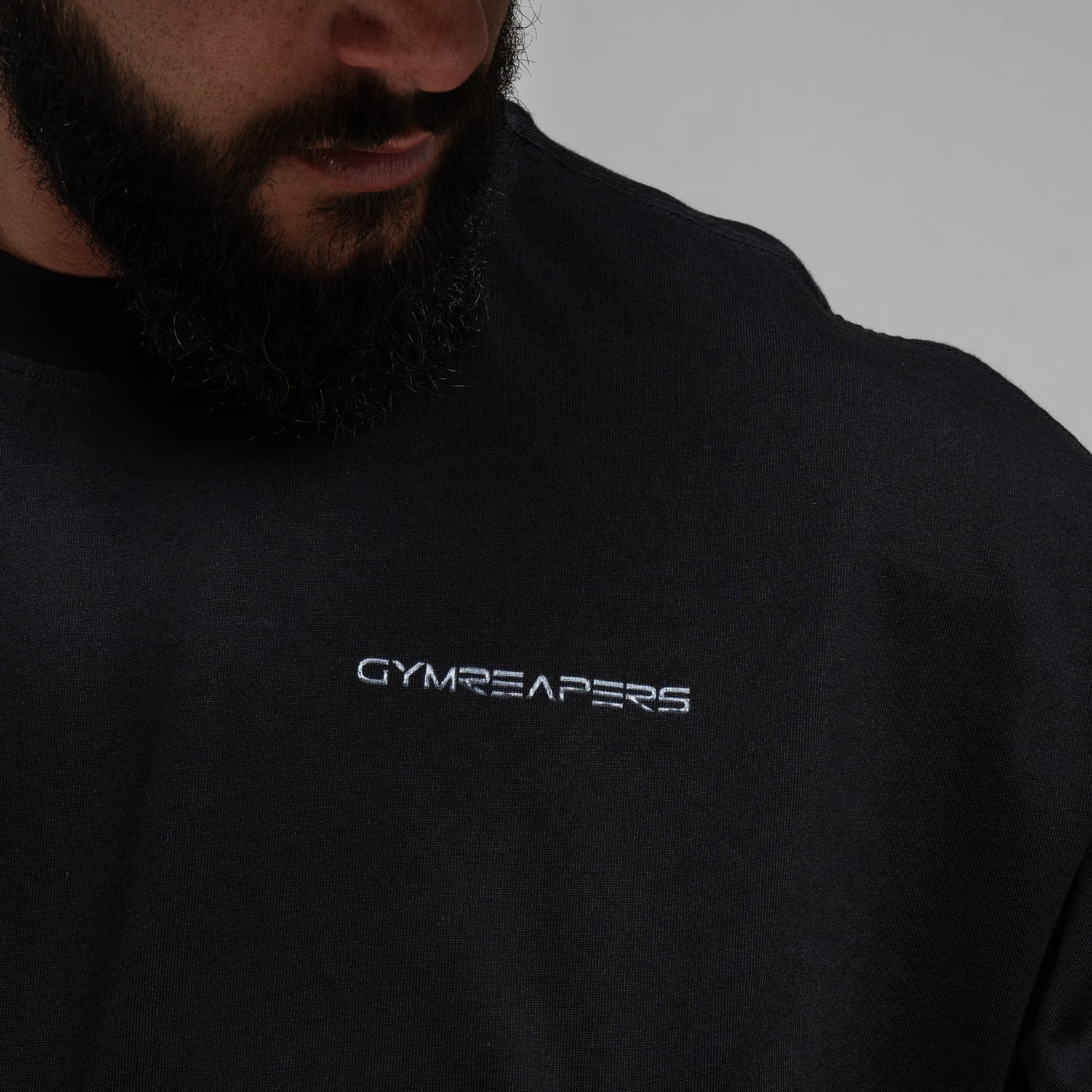 Athlete wearing Chrome Legacy Long Sleeve Shirt close up shot of front logo