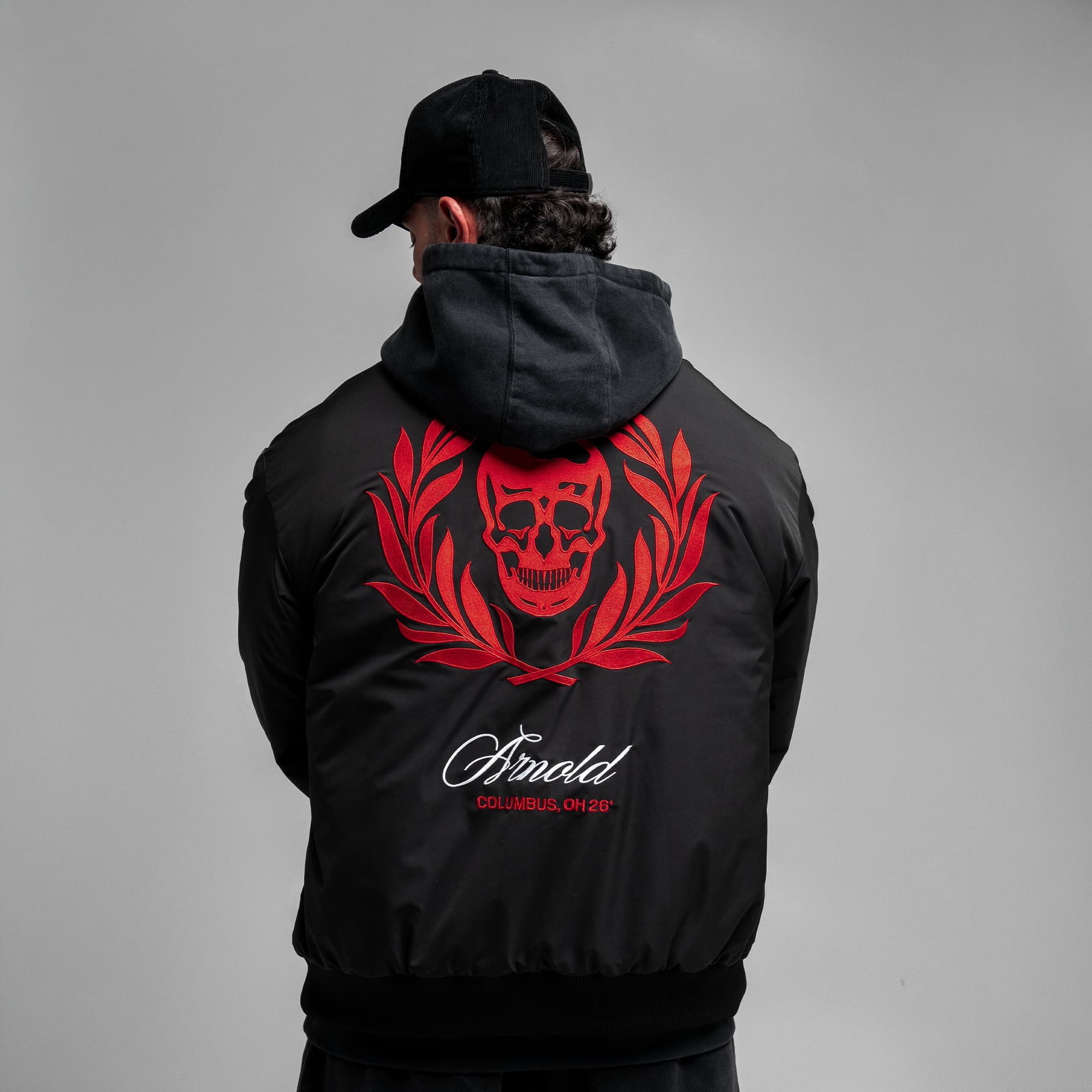 Athlete wearing the Ohio Bomber Jacket half body shot back view