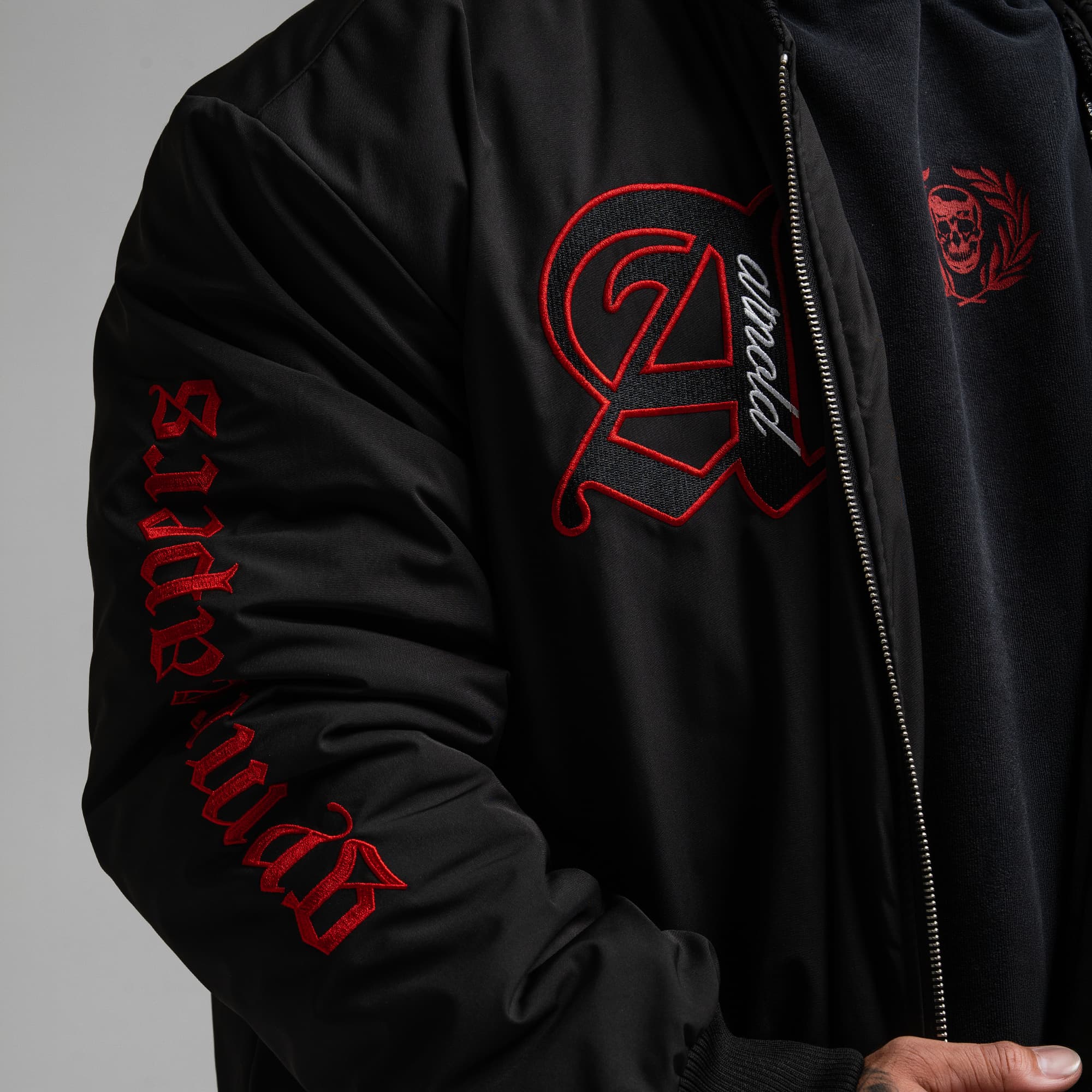 Athlete wearing the Ohio Bomber Jacket close up shot of sleeve and chest graphics