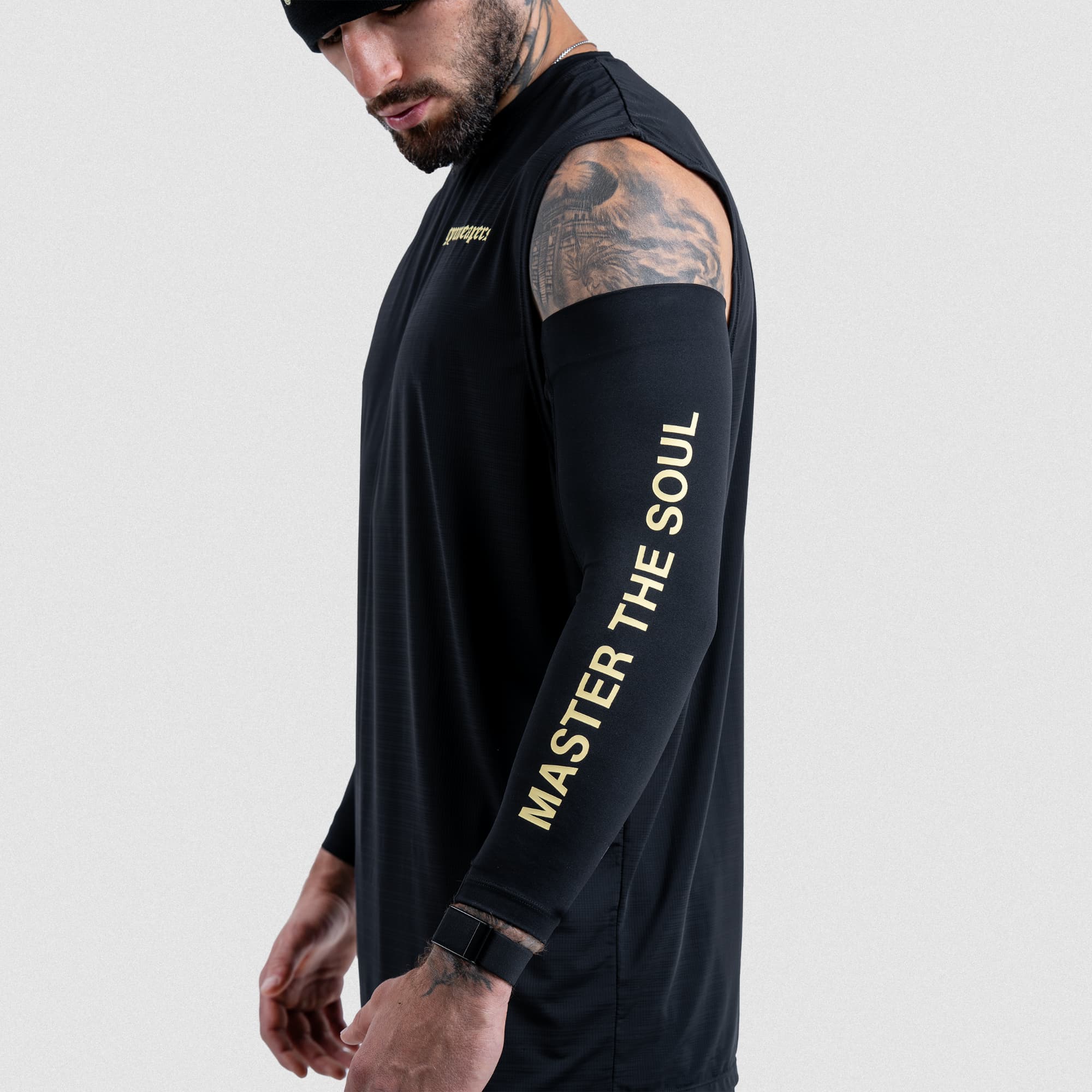 Athlete showing Master the Soul text on black arm warmer