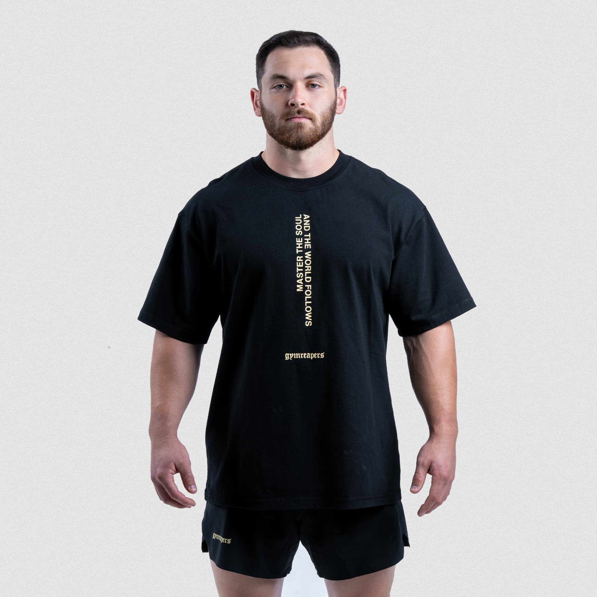 Model wearing the Master The Soul Graphic Tee styled with matching black shorts from the Gymreapers Master The Soul Collection