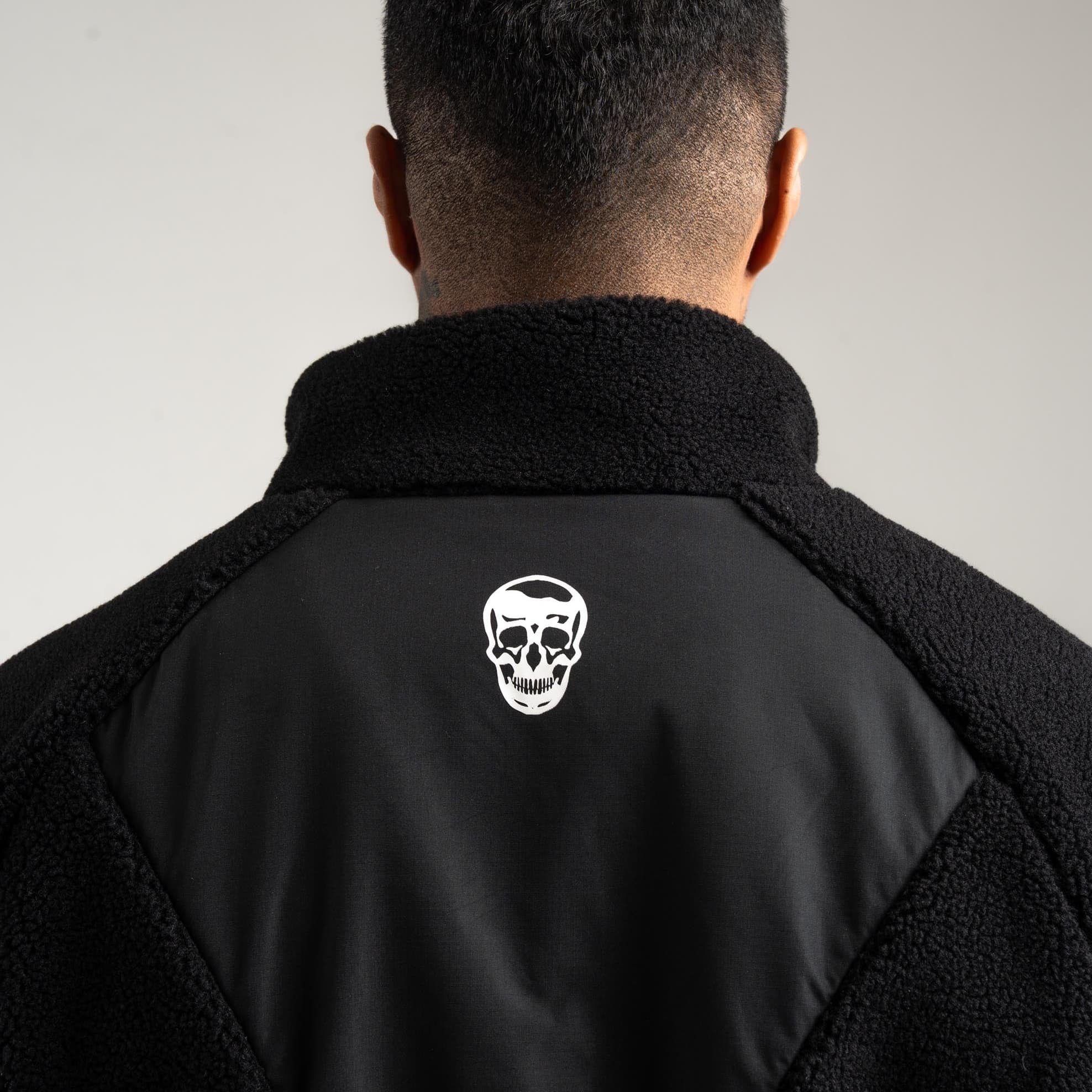 Athlete wearing Sektor Sherpa Jacket close up shot of back logo