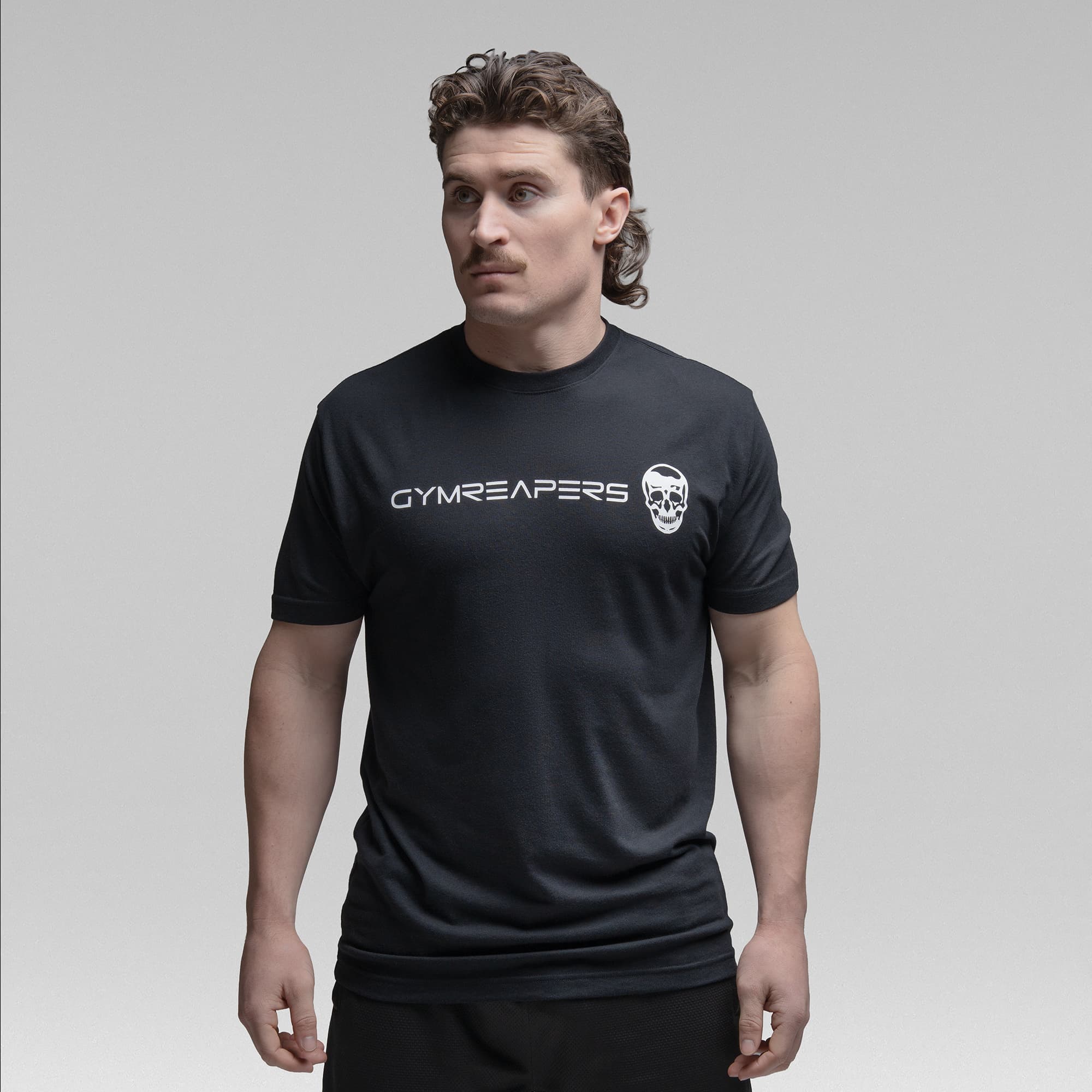 Athlete wearing the black tri blend tee half body shot front view