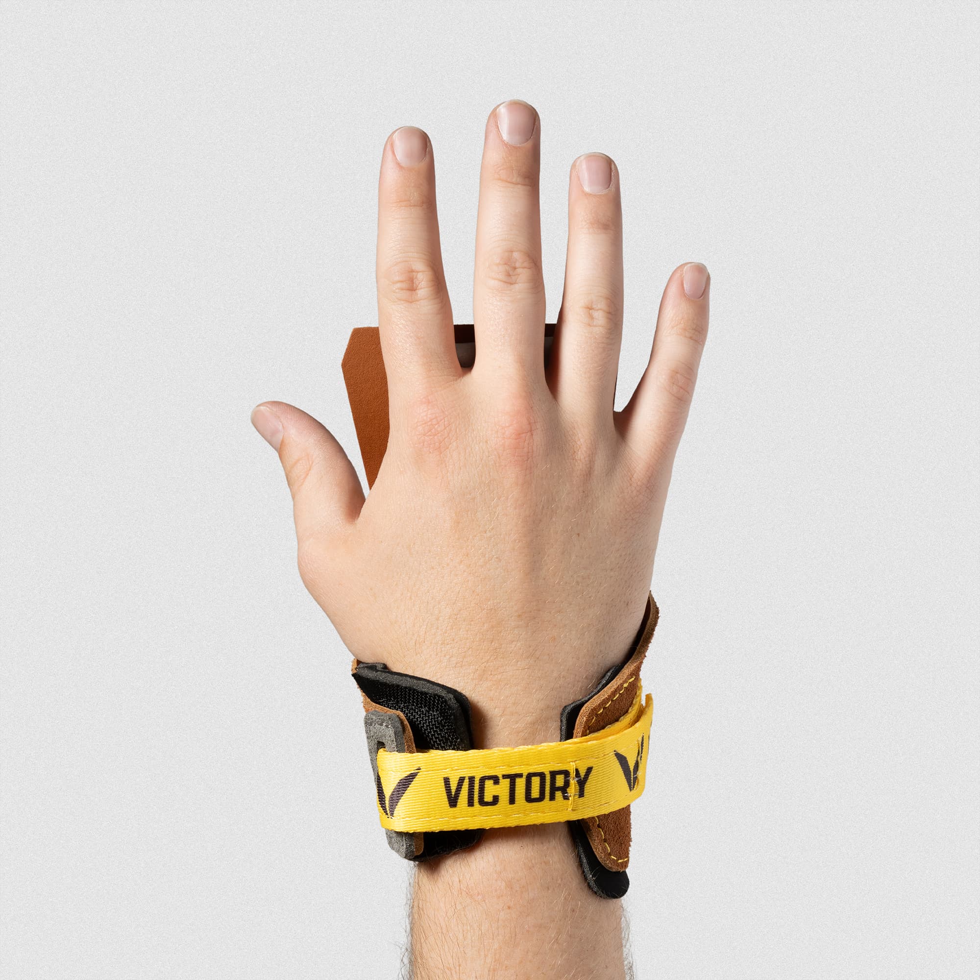 Men's V-Series Freedom Leather in Tan – Hand extended and palm facing away to show the hook and loop closure wrist design