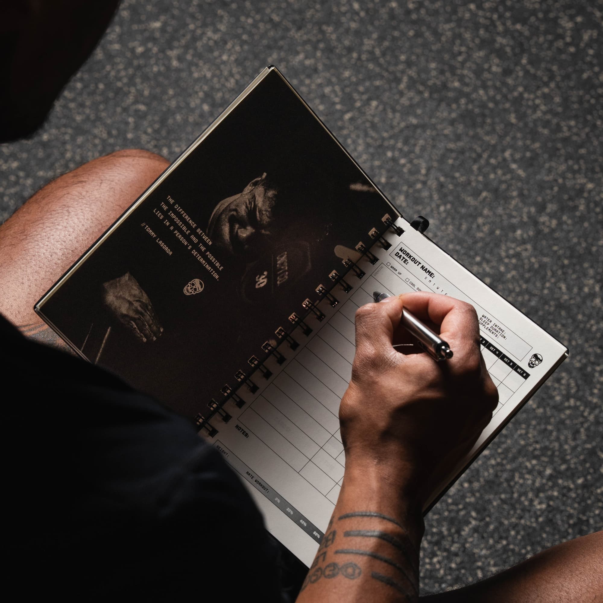 shot of athlete logging workout in the workout journal