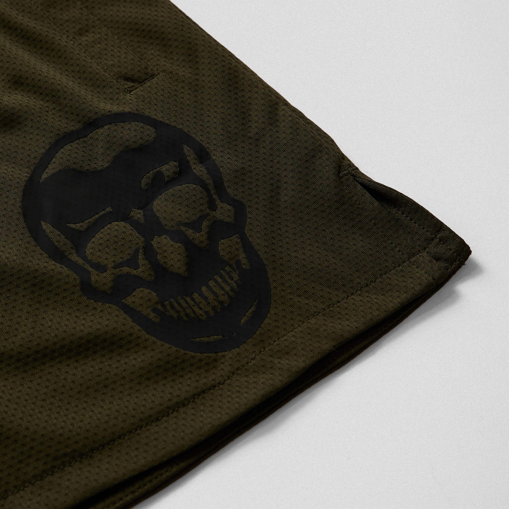mesh shorts od green skull detail