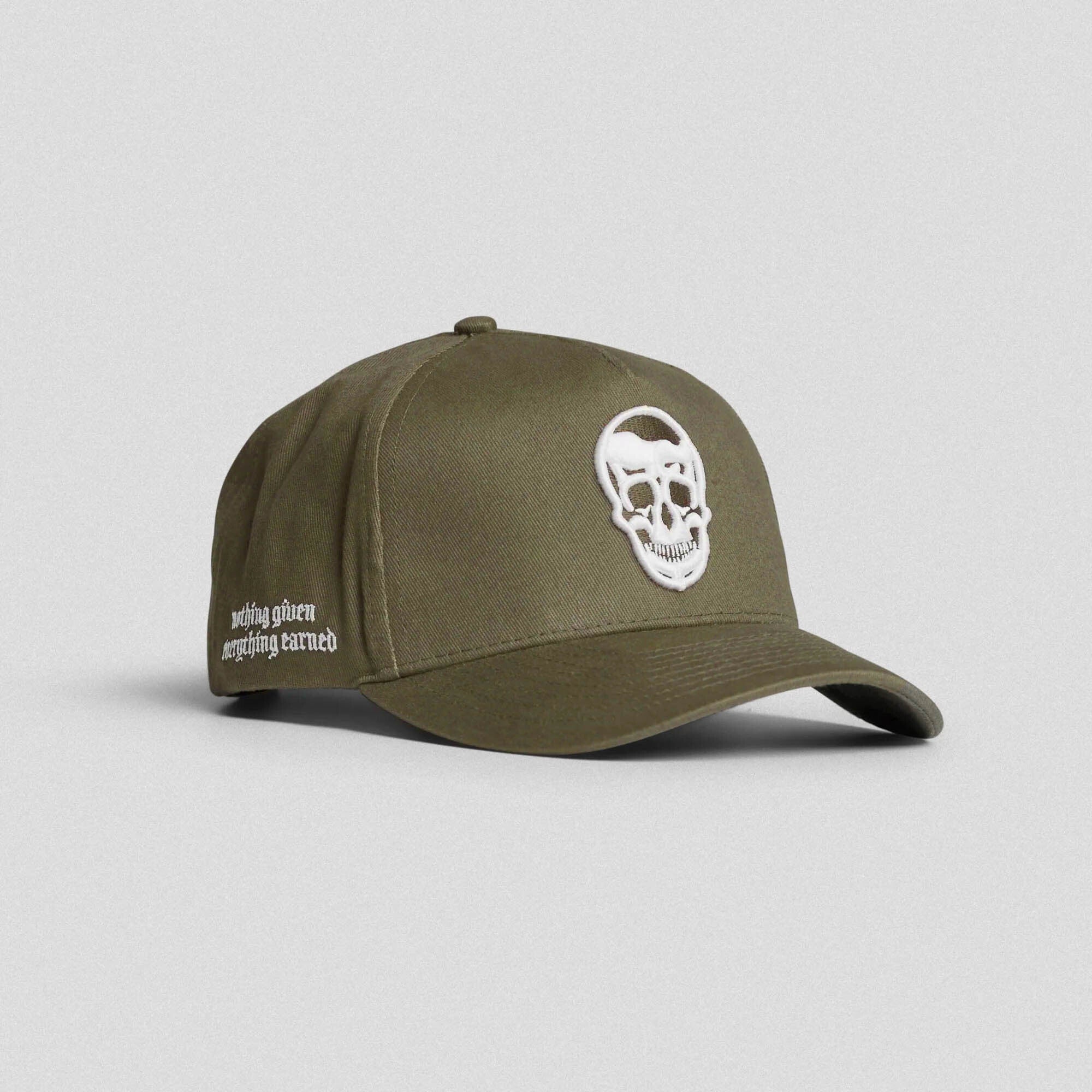 Olive 5-panel skull hat with white embroidered logo and side text reading "nothing given everything earned"