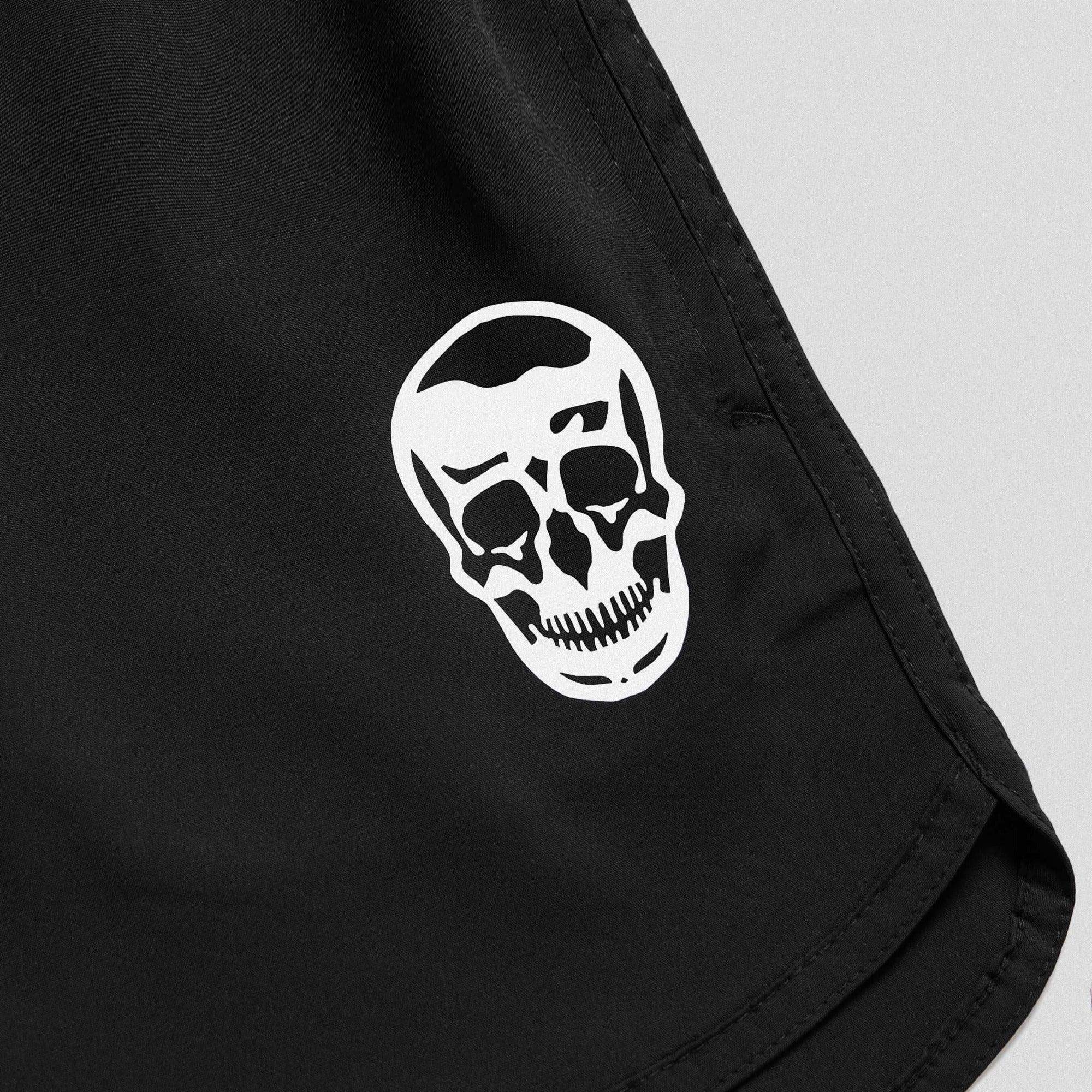 black training shorts lay flat close up shot of logo