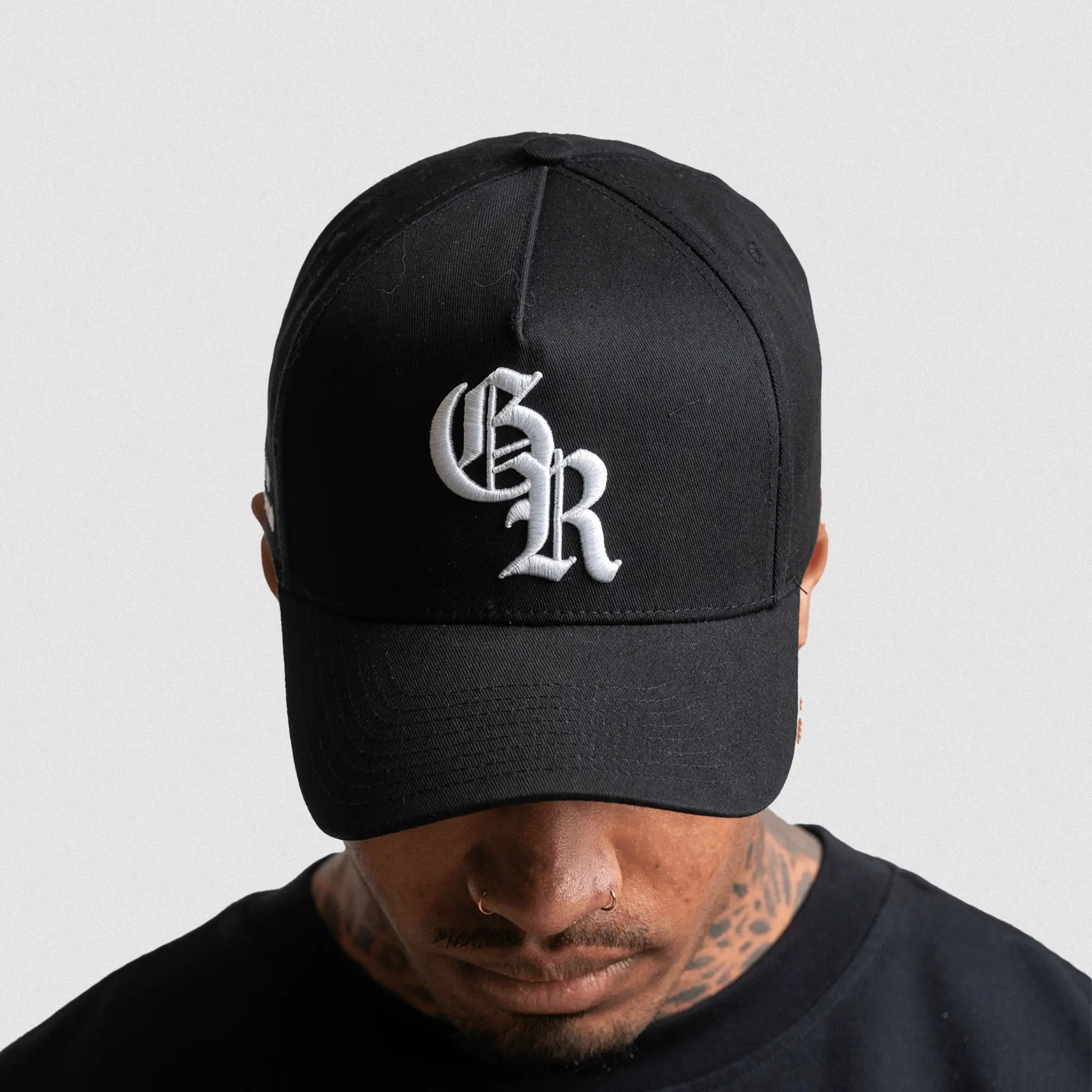 5 panel initial hat black white on athlete studio gray background front shot