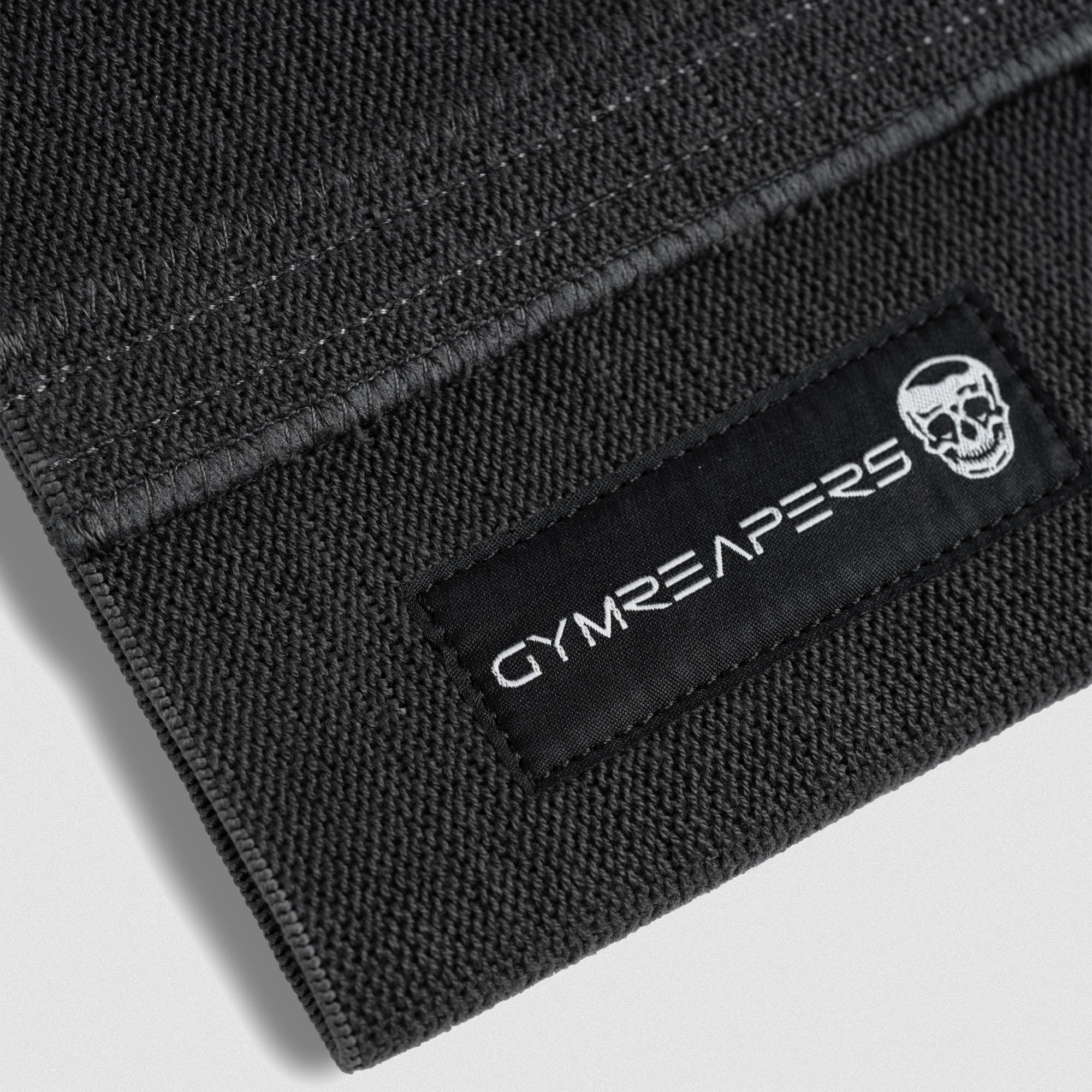 close up detail shot of elbow compression cuff logo