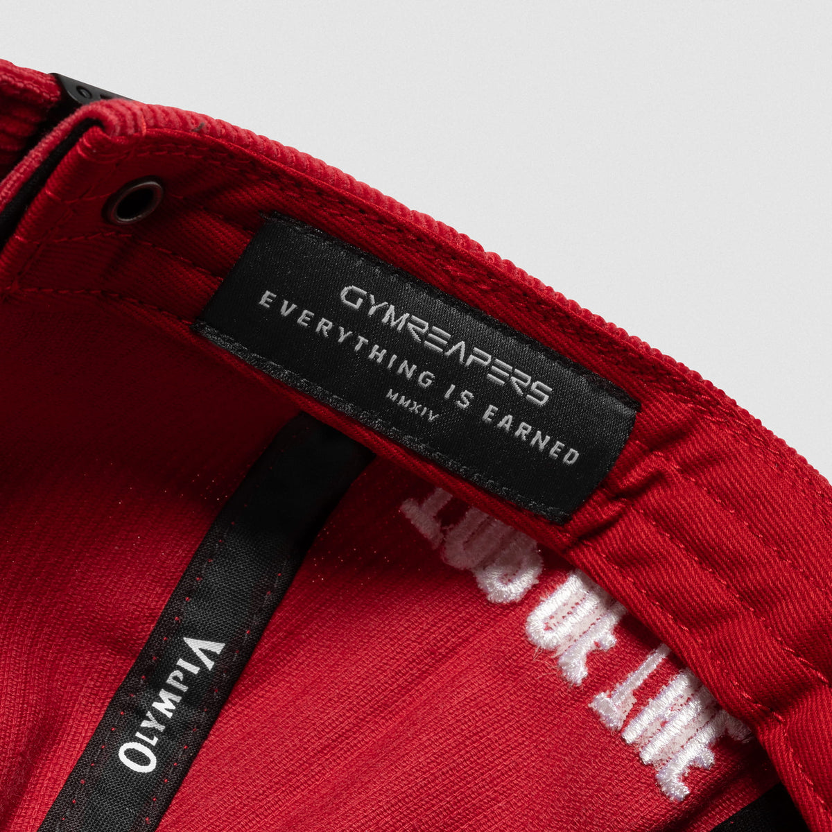 Inside tag of the Mr. Olympia Corduroy 5-Panel Hat with GYMREAPERS Everything Earned MMXIV text