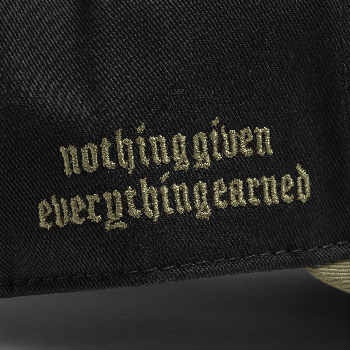 5-Panel Skull Hat in Black/Green – Brim Wordmark Detail
