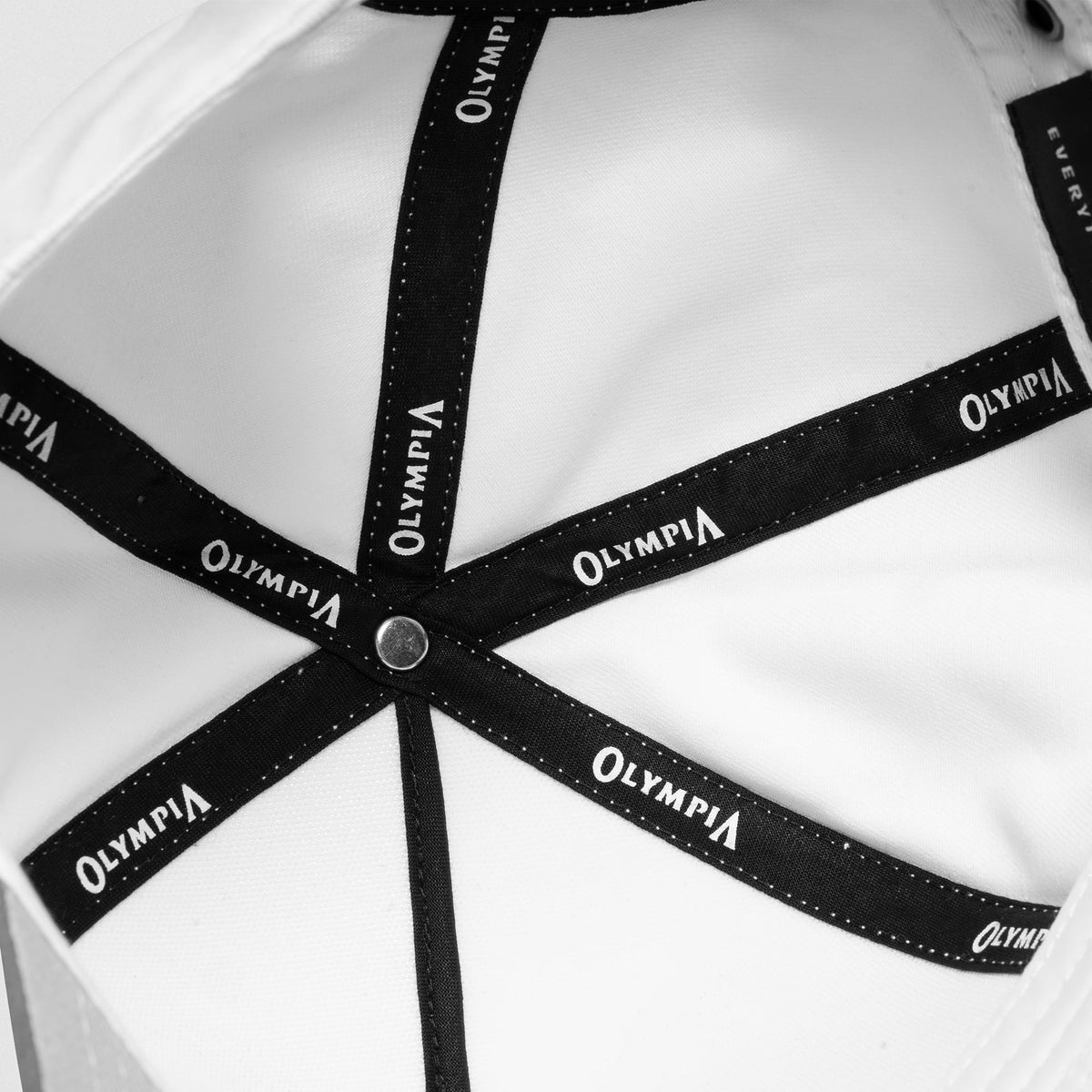 Inside of the International Division Suede 5-Panel Hat that displays the Olympia text on the internal structure of the hat