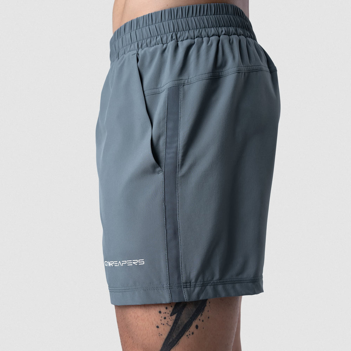 Male model wearing the Axis 6" Lined Shorts - Lake lower-body view