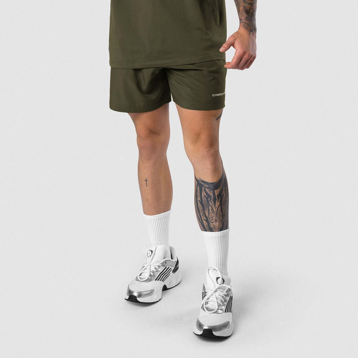 Male model wearing the Axis 6" Lined Shorts - OD Green front view