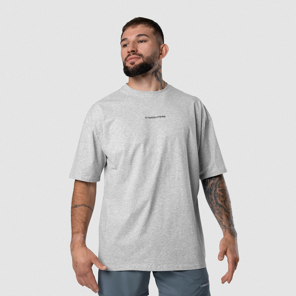 Male model wearing the Axis Box Tee - Heather Gray front view