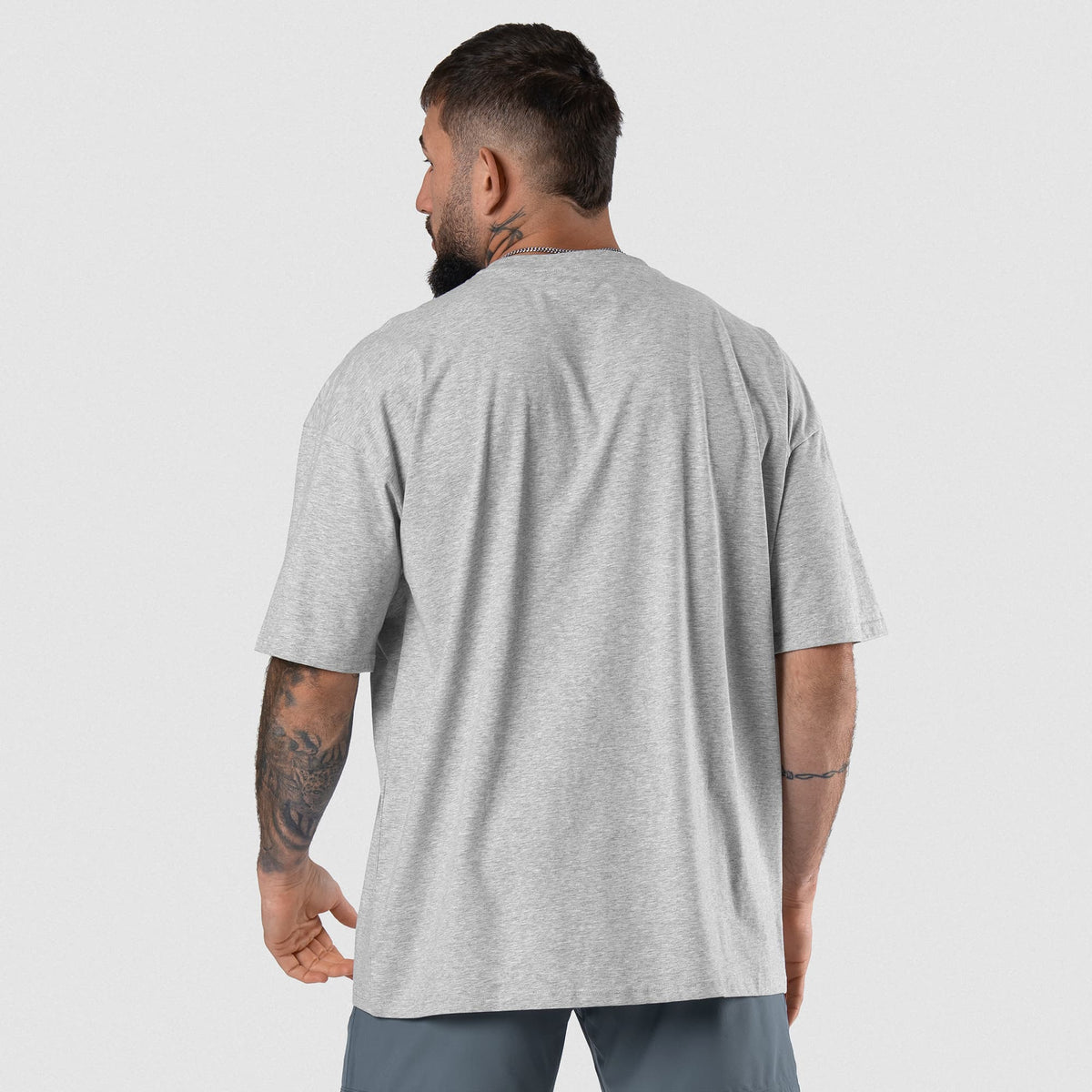 Male model wearing the Axis Box Tee - Heather Gray back view