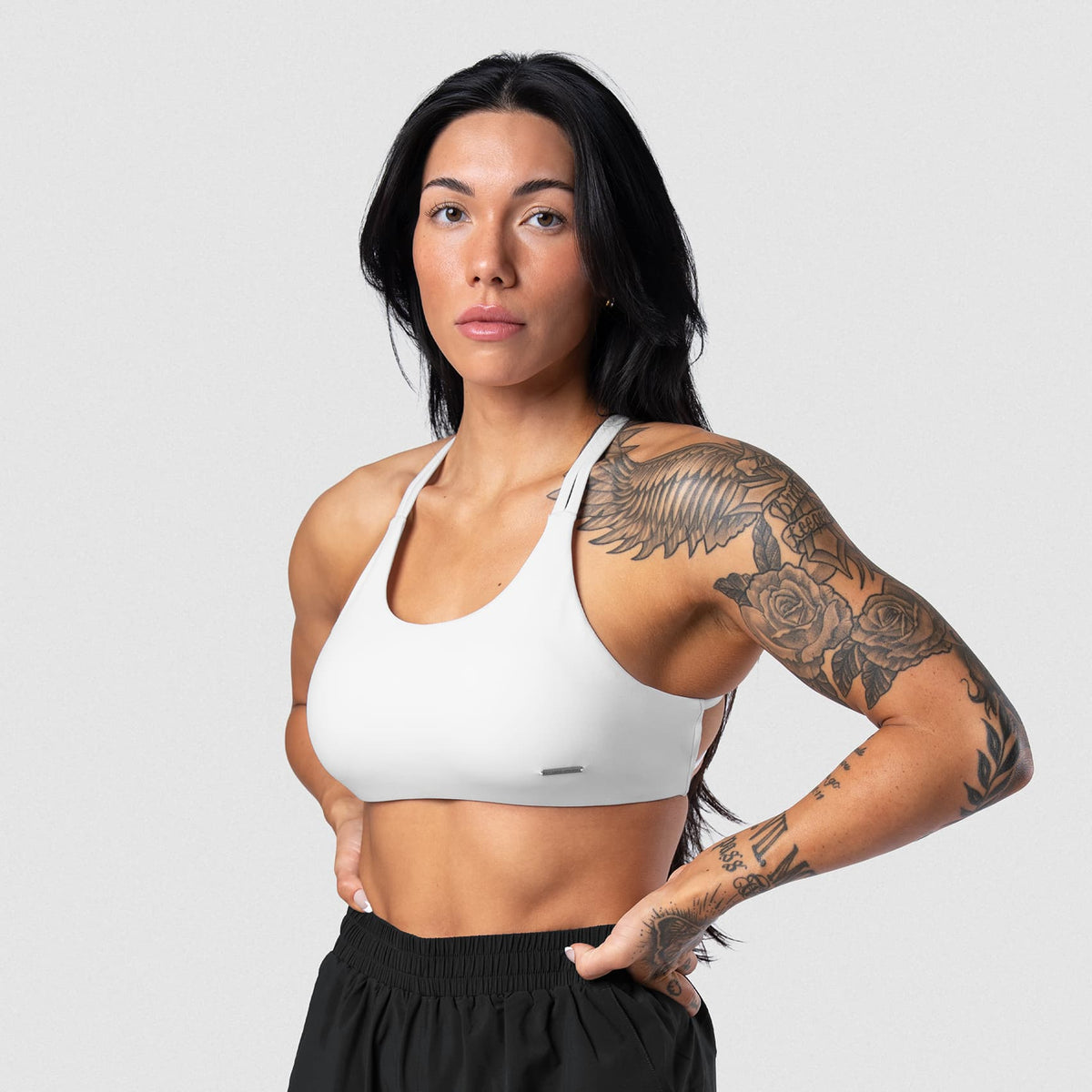 Female model wearing the Axis Open Back Bra - White front view