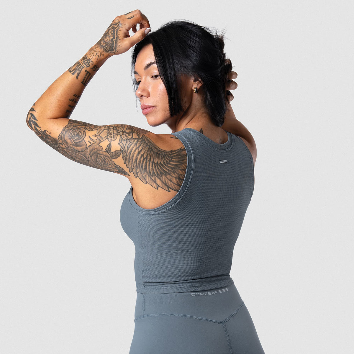 Female model wearing the Axis Support Tank - Lake back view