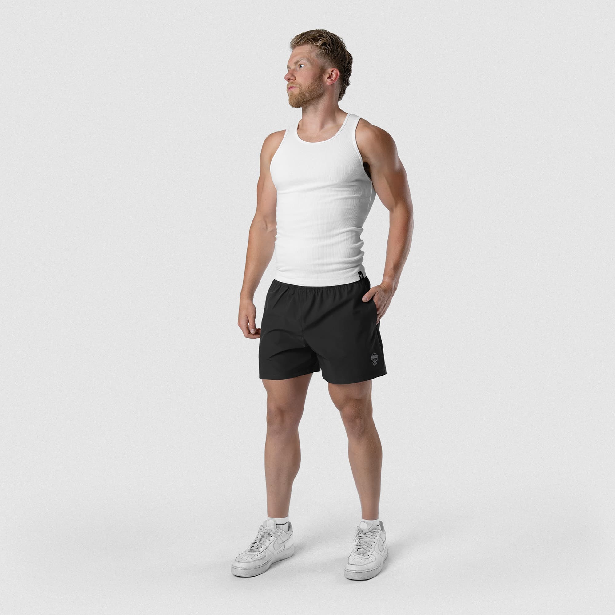 Model wearing Men's Conquer 5 Inch Shorts - Black