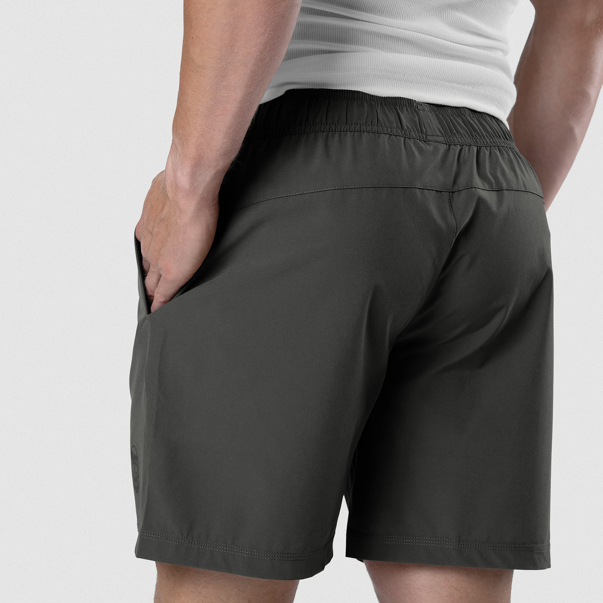 Back view of Men's Conquer 7 Inch Shorts on model - Dark Gray