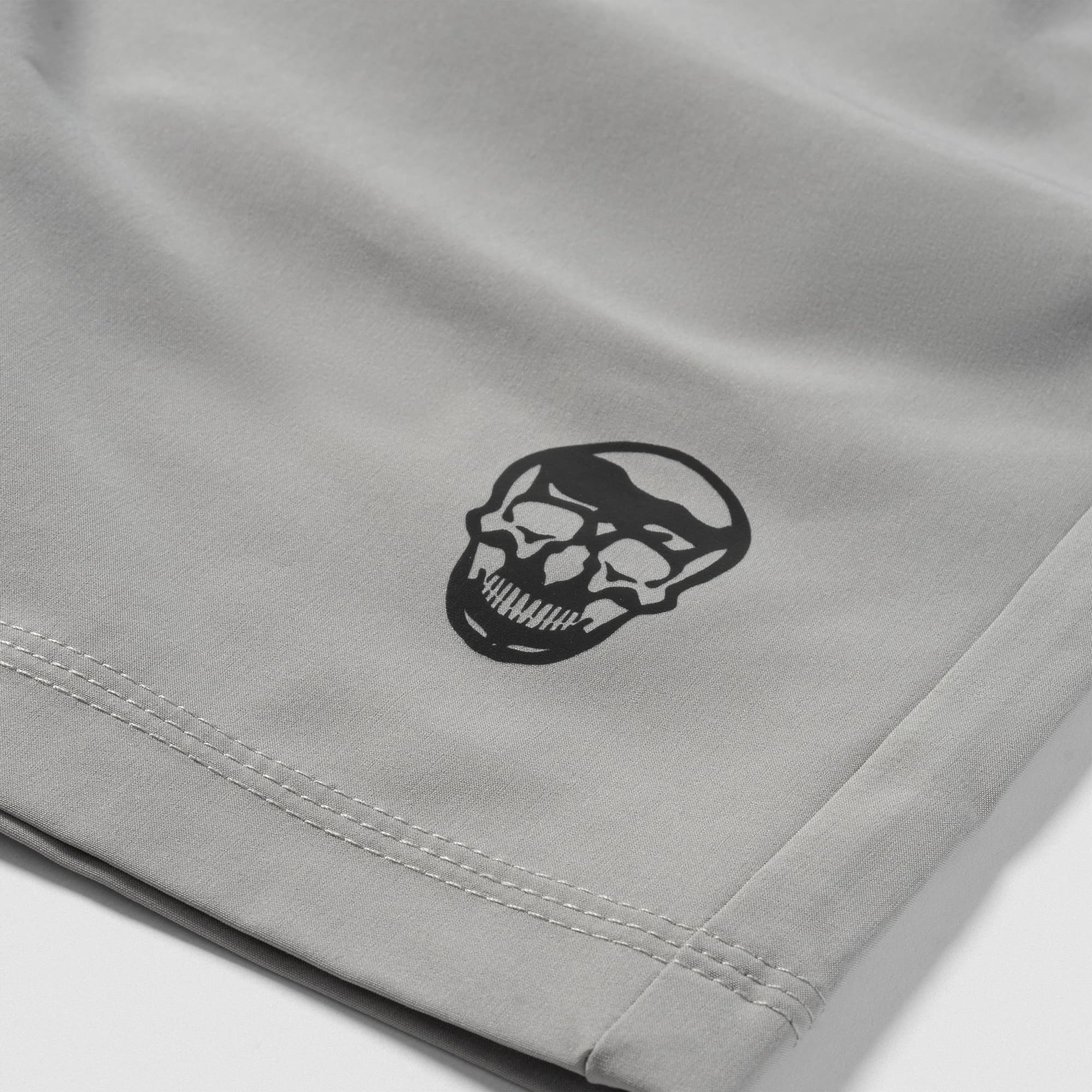 Reflective Gymreapers skull logo detail on Men's Conquer 7 Inch Shorts - Gray