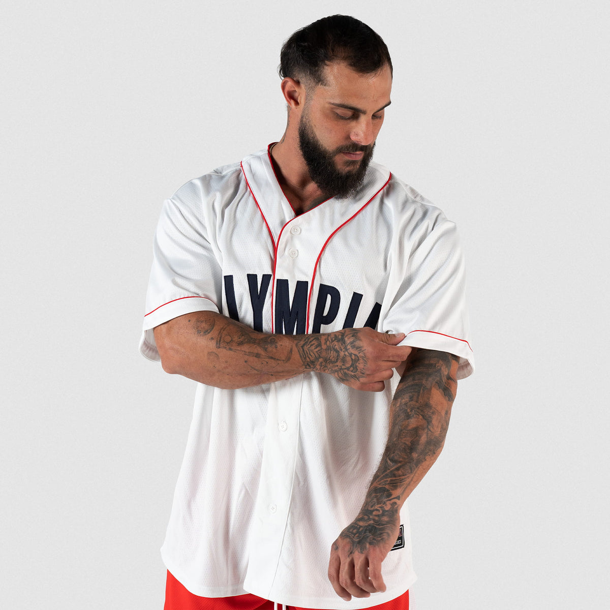 Olympia Americana Jersey | Male model wearing jersey fully buttoned and adjusting his sleeve