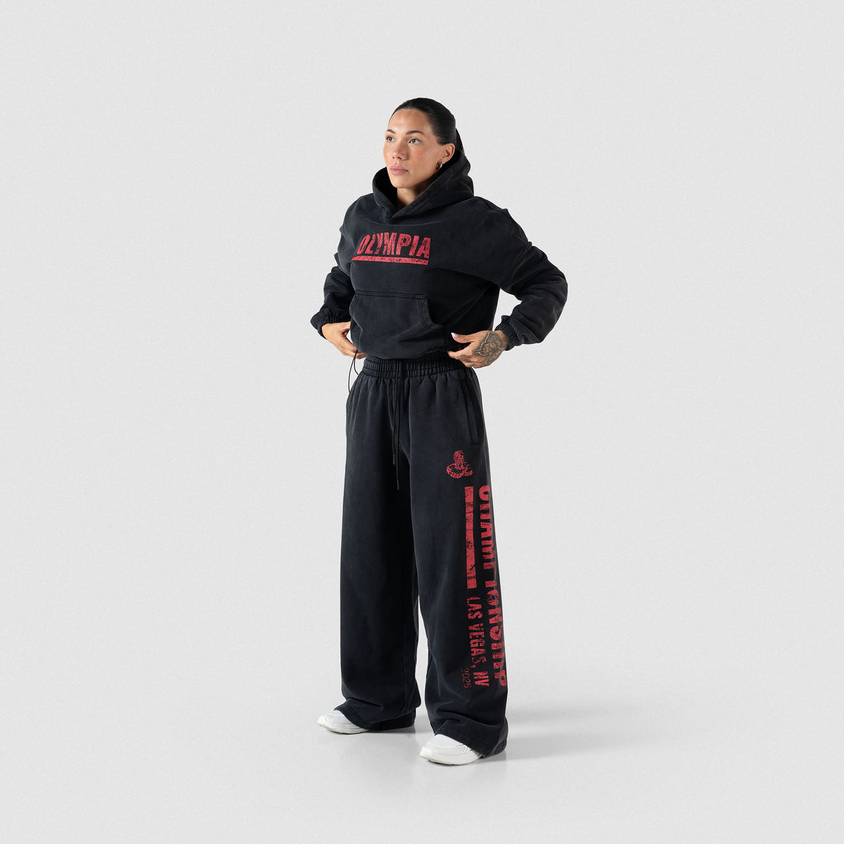 Championship Crop Hoodie | Full body, front model view of black hoodie and matching joggers