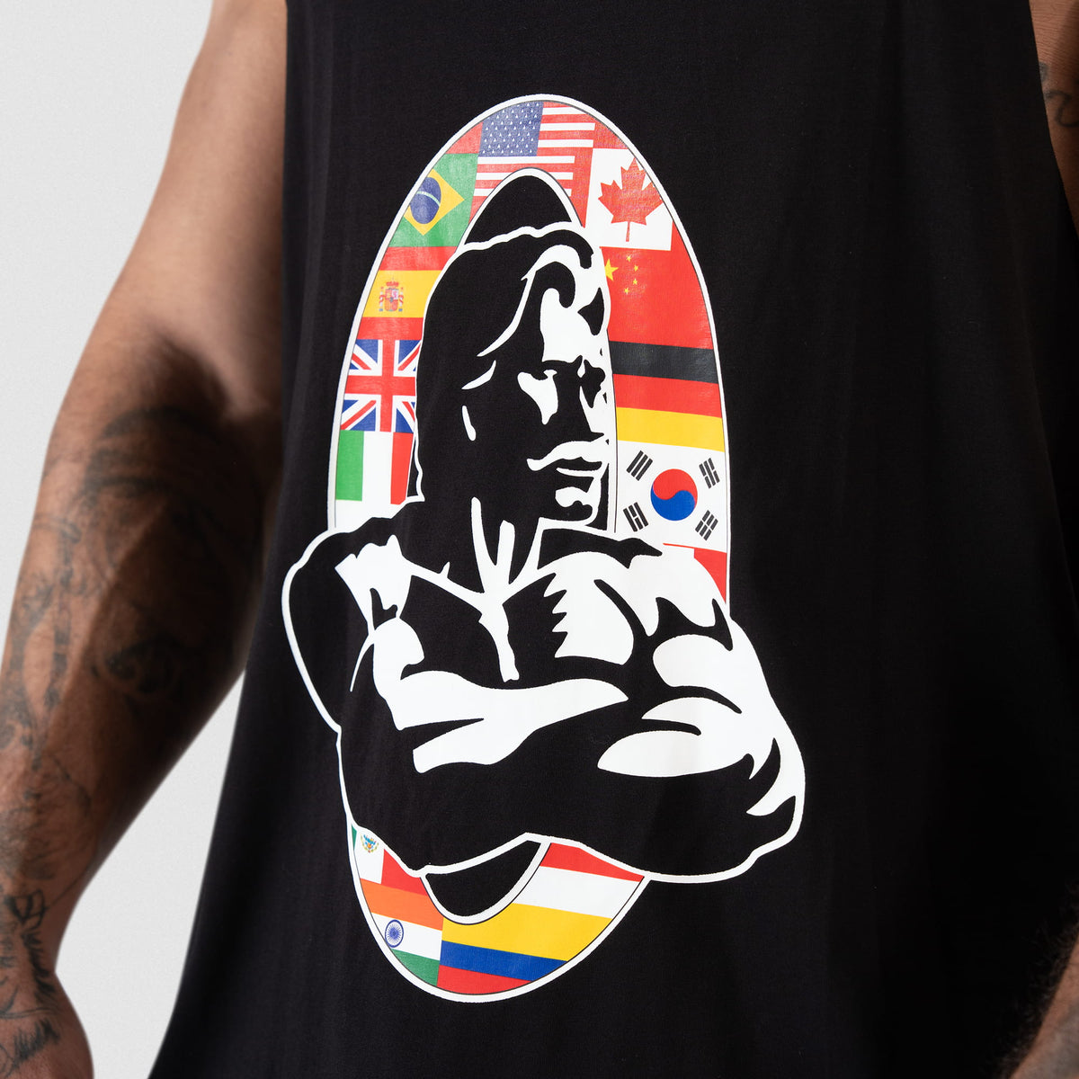 Close up view of the international flag Olympia bodybuilding logo on the black Olympia International Division Stringer tank top