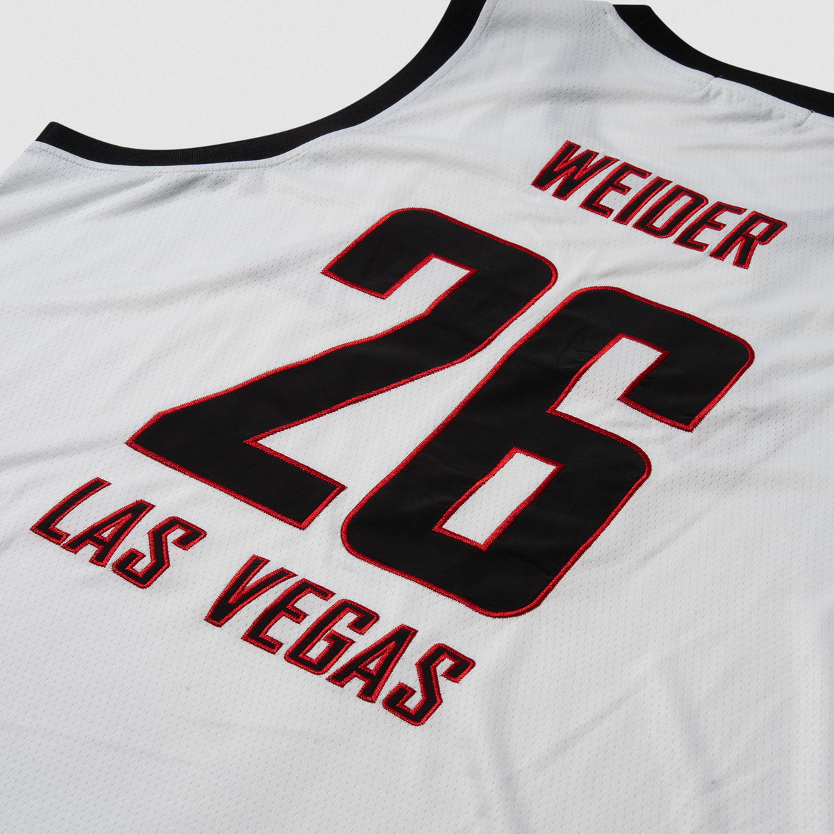 Signature Jersey | Close up of large back logo that says "Weider Las Vegas" and "26" in black text and red borders