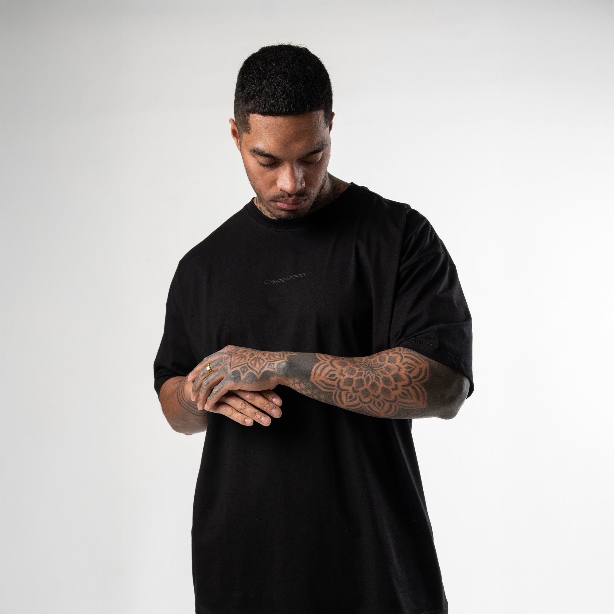 athlete wearing black axis box tee front view