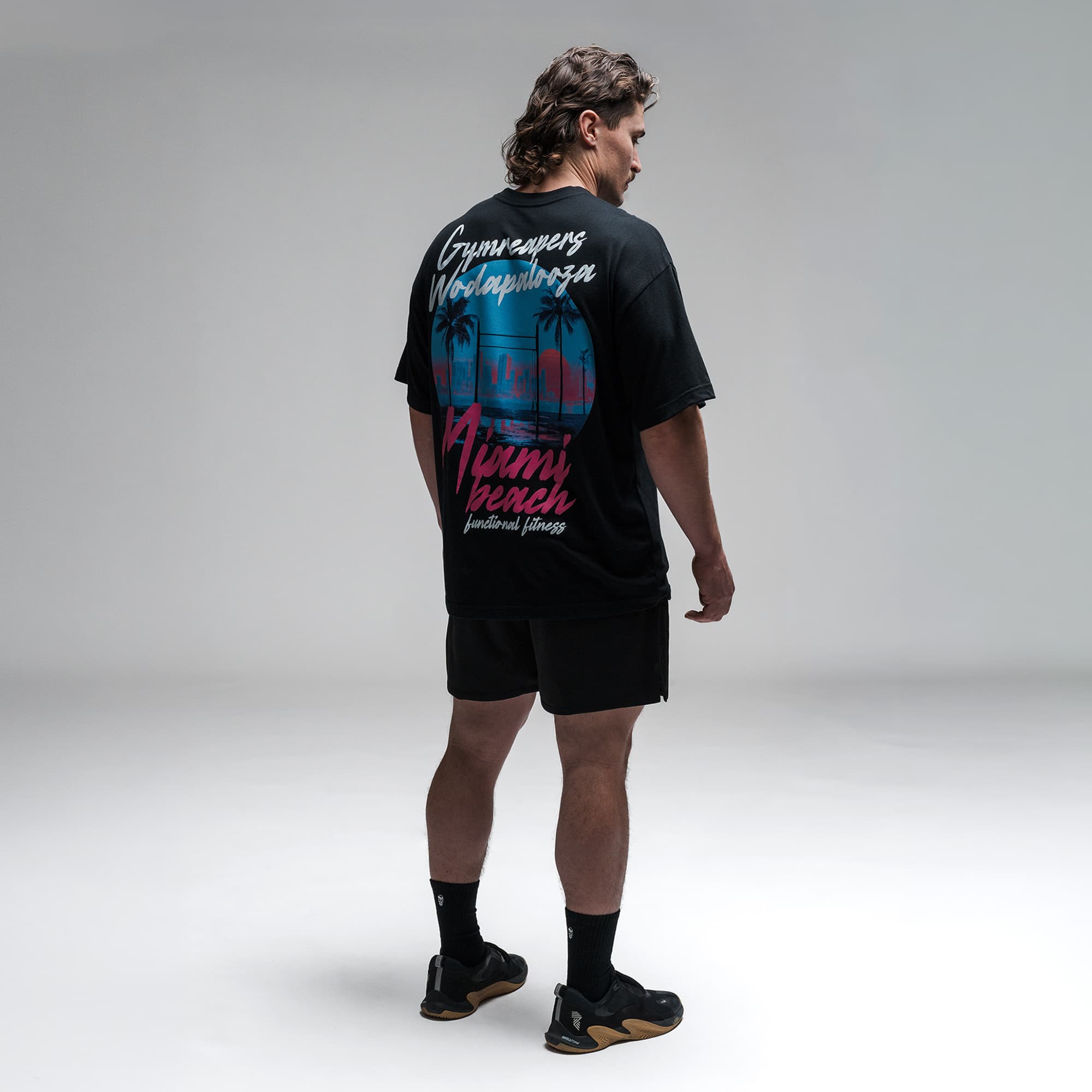 Athlete wearing the Skyline Tee full body shot back view