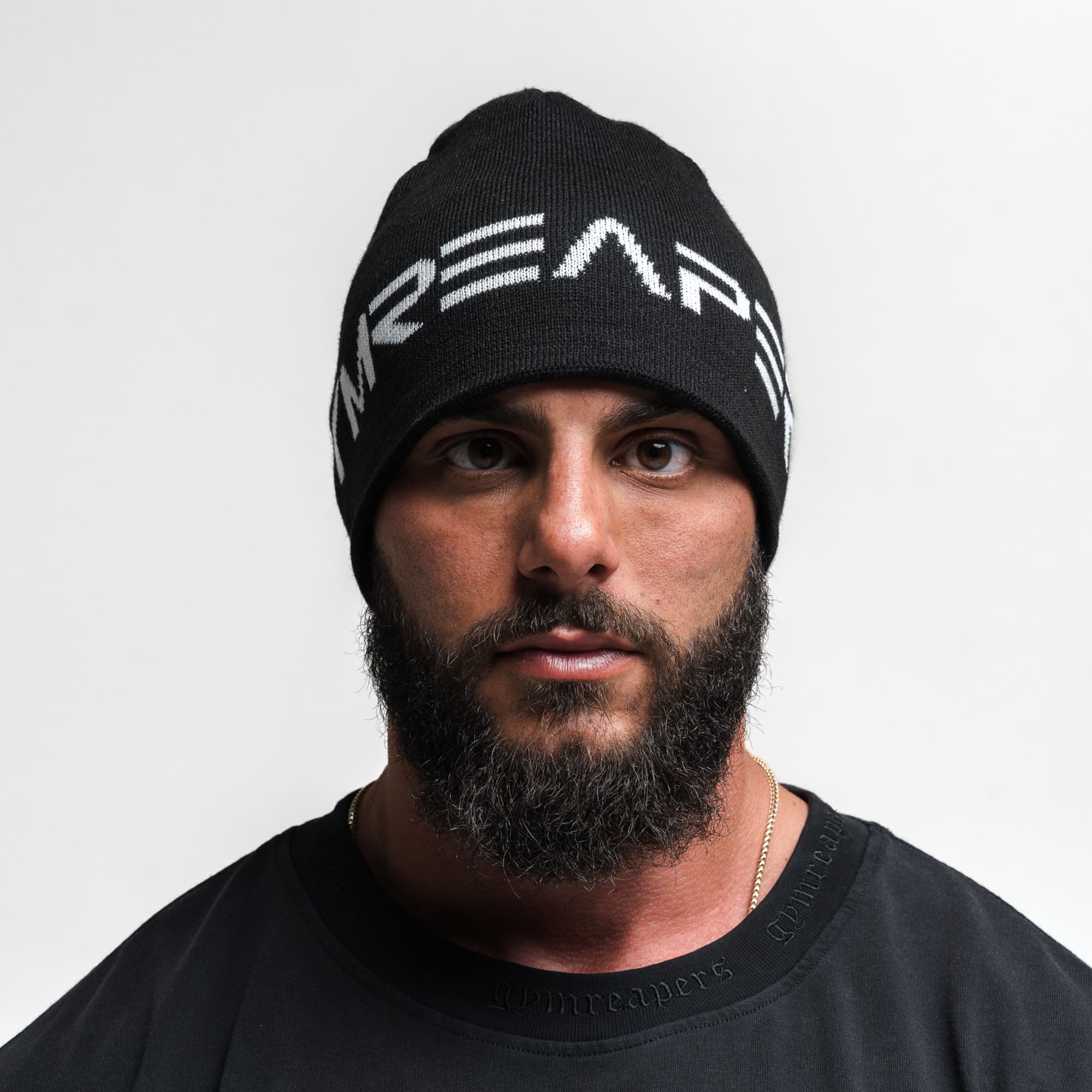 Athlete wearing Core Logo Skull Cap Beanie - Black front view