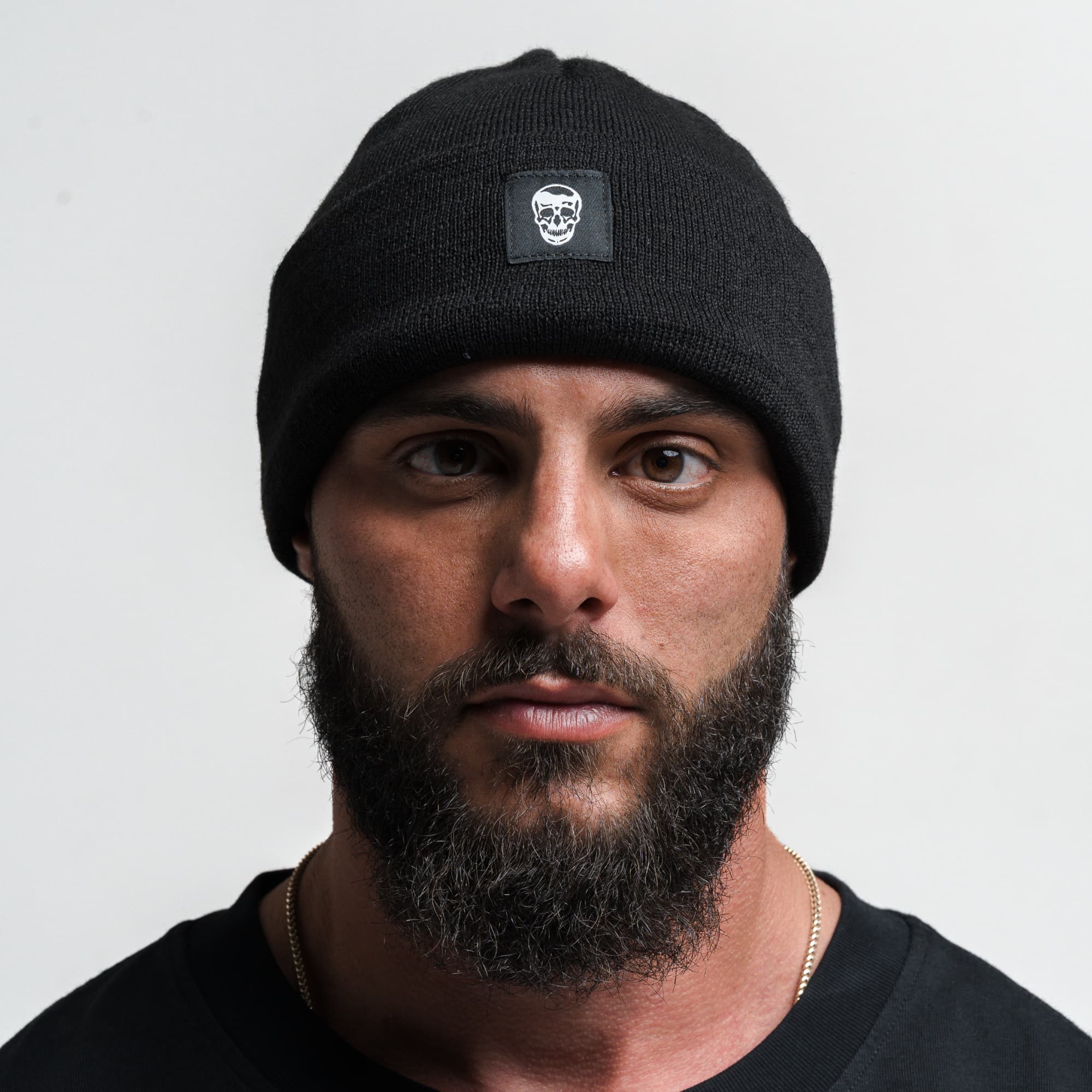 Athlete wearing Skull Knit Cuff Beanie - Black front view