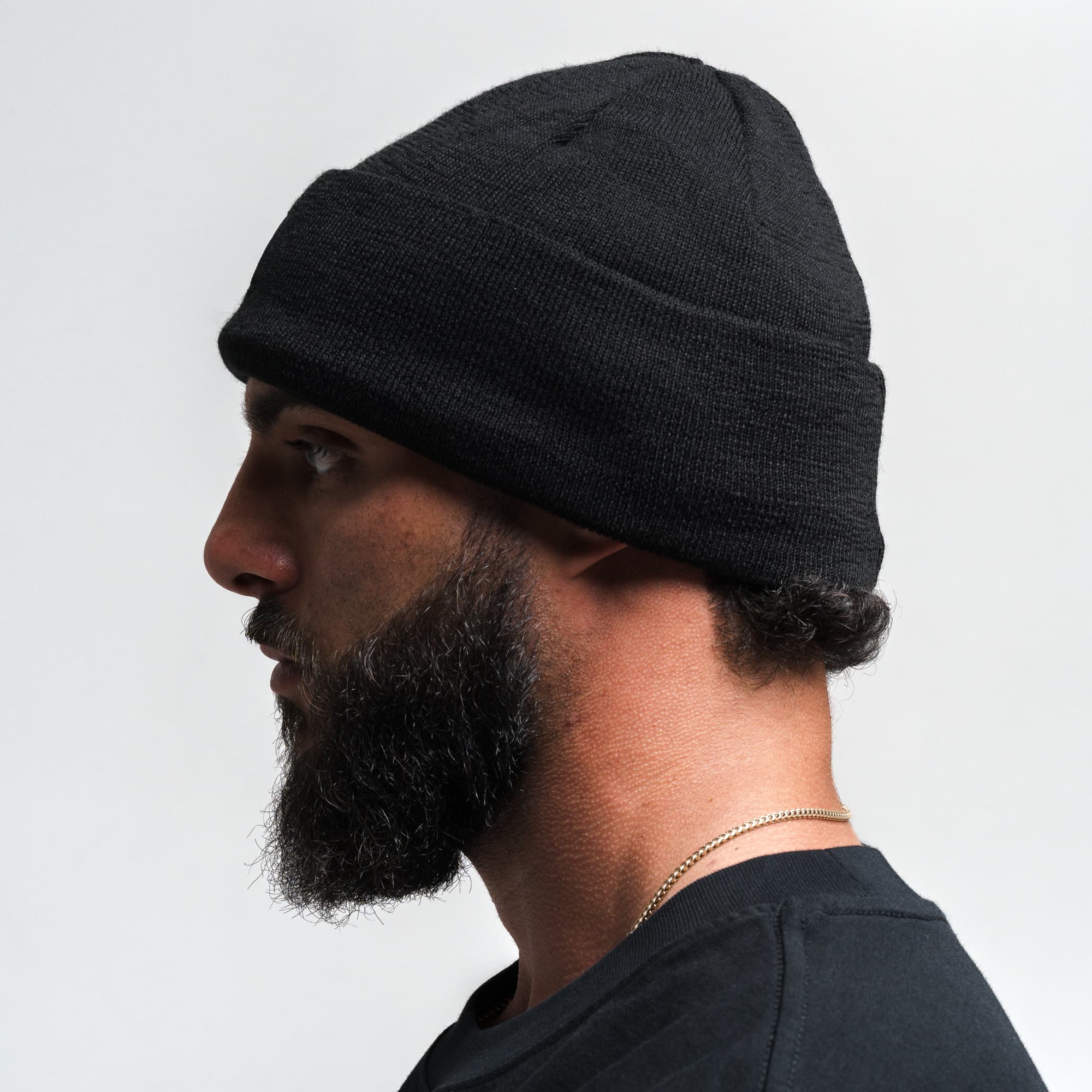 Athlete wearing Skull Knit Cuff Beanie - Black side view