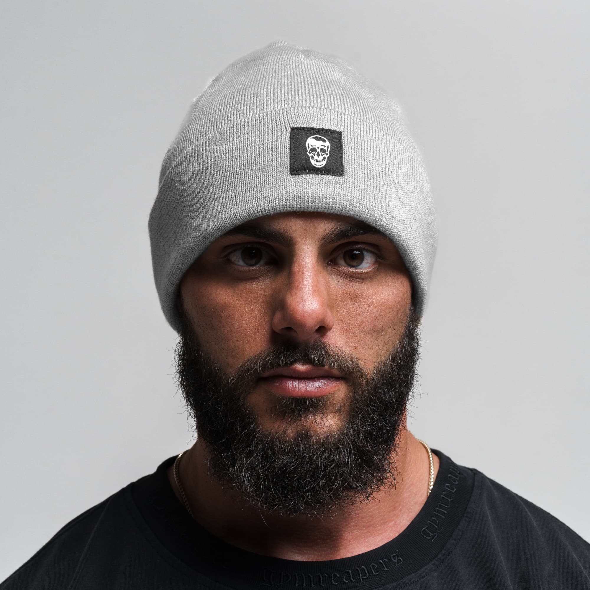 Athlete wearing Skull Knit Cuff Beanie - Slate front view