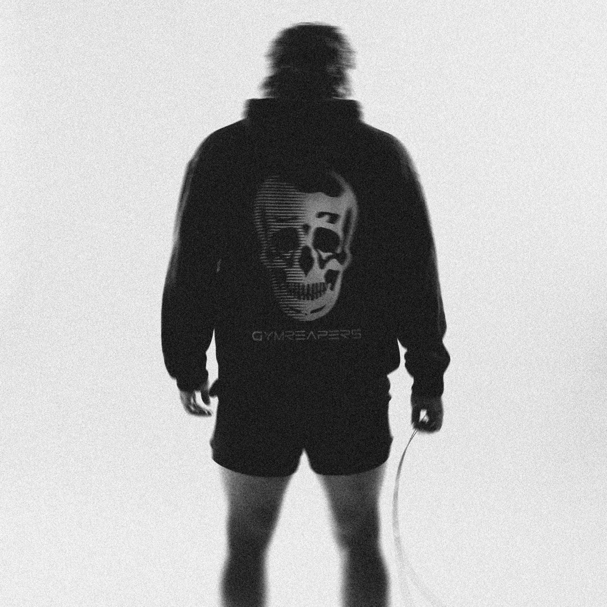 lifestyle shot of athlete wearing static ops hoodie showcasing back graphic