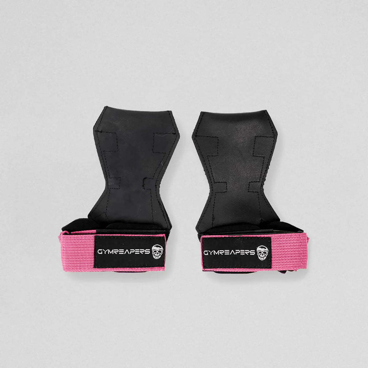 Gymreapers lifting grips pink both flat and both having the velcro closed.