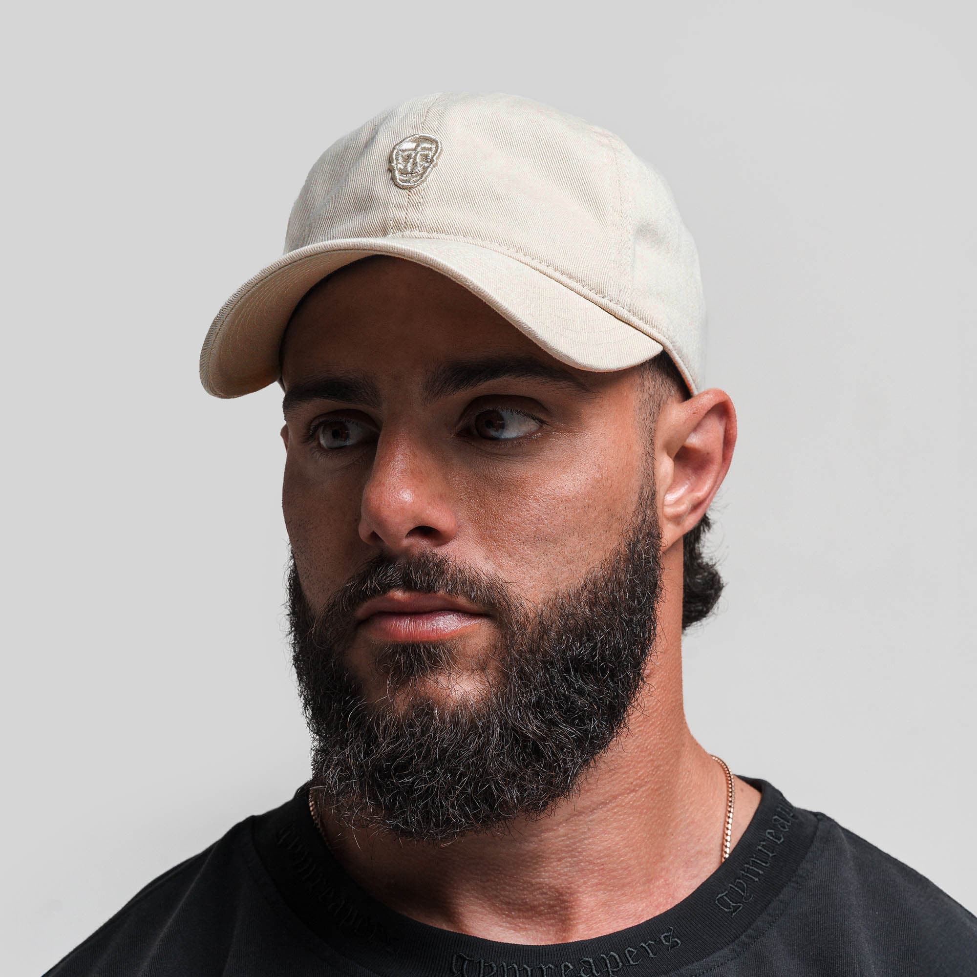 Athlete wearing Washed 6-Panel Dad Hat - Tan front view