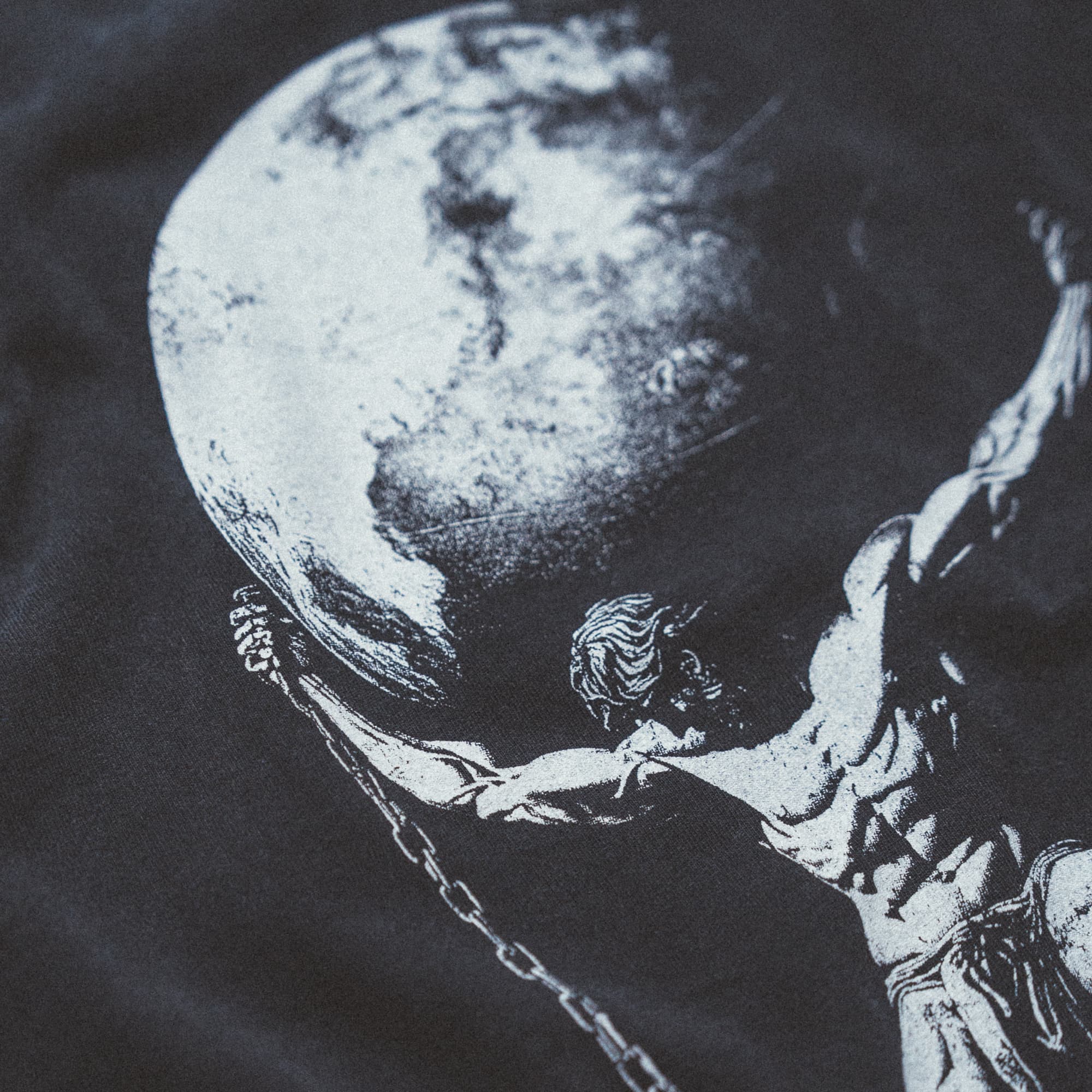 Detail shot of the back graphic on the As Above So Below Graphic Tee in black, highlighting the Atlas design.